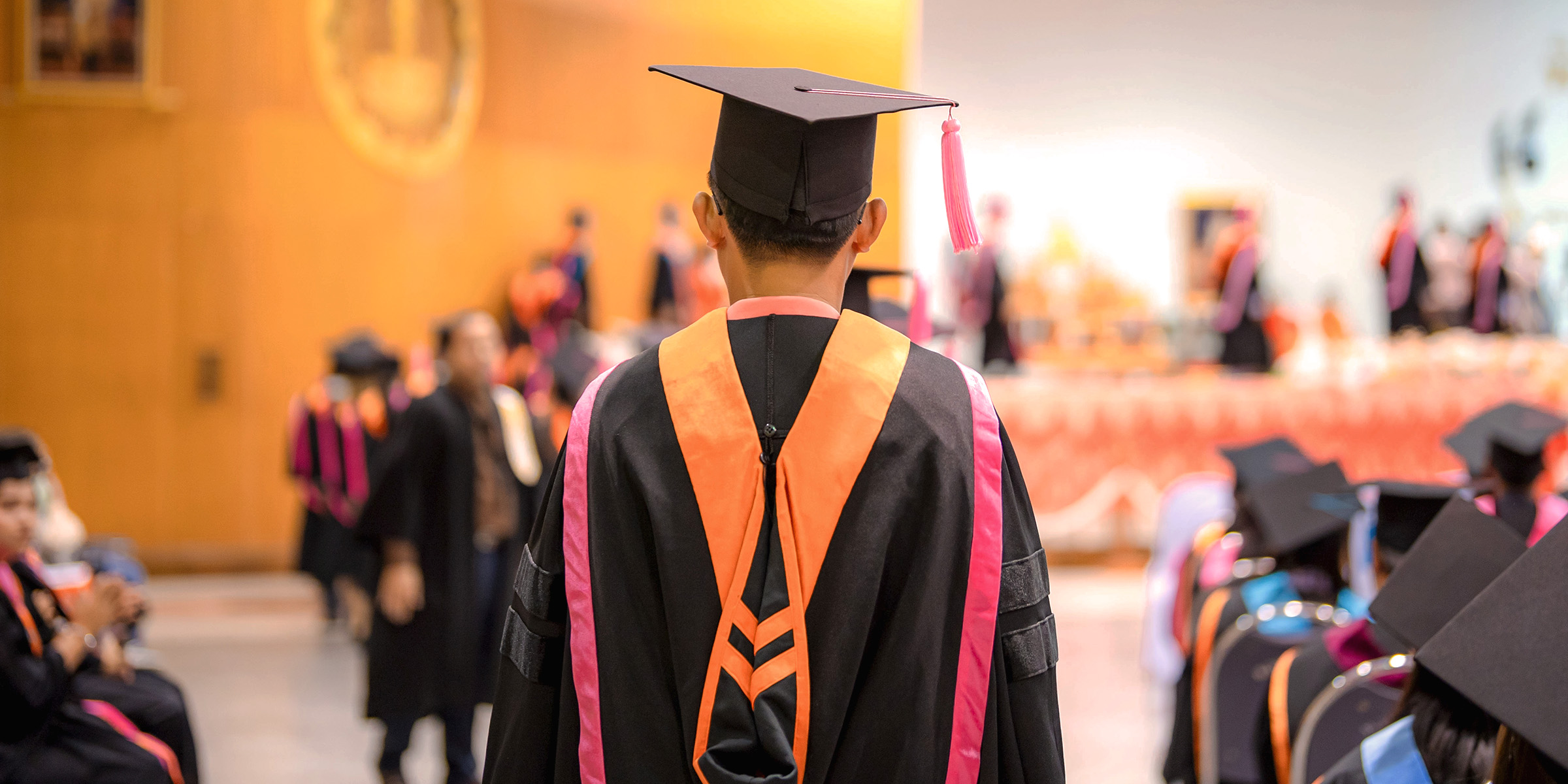College students at a graduation ceremony | Source: Shutterstock