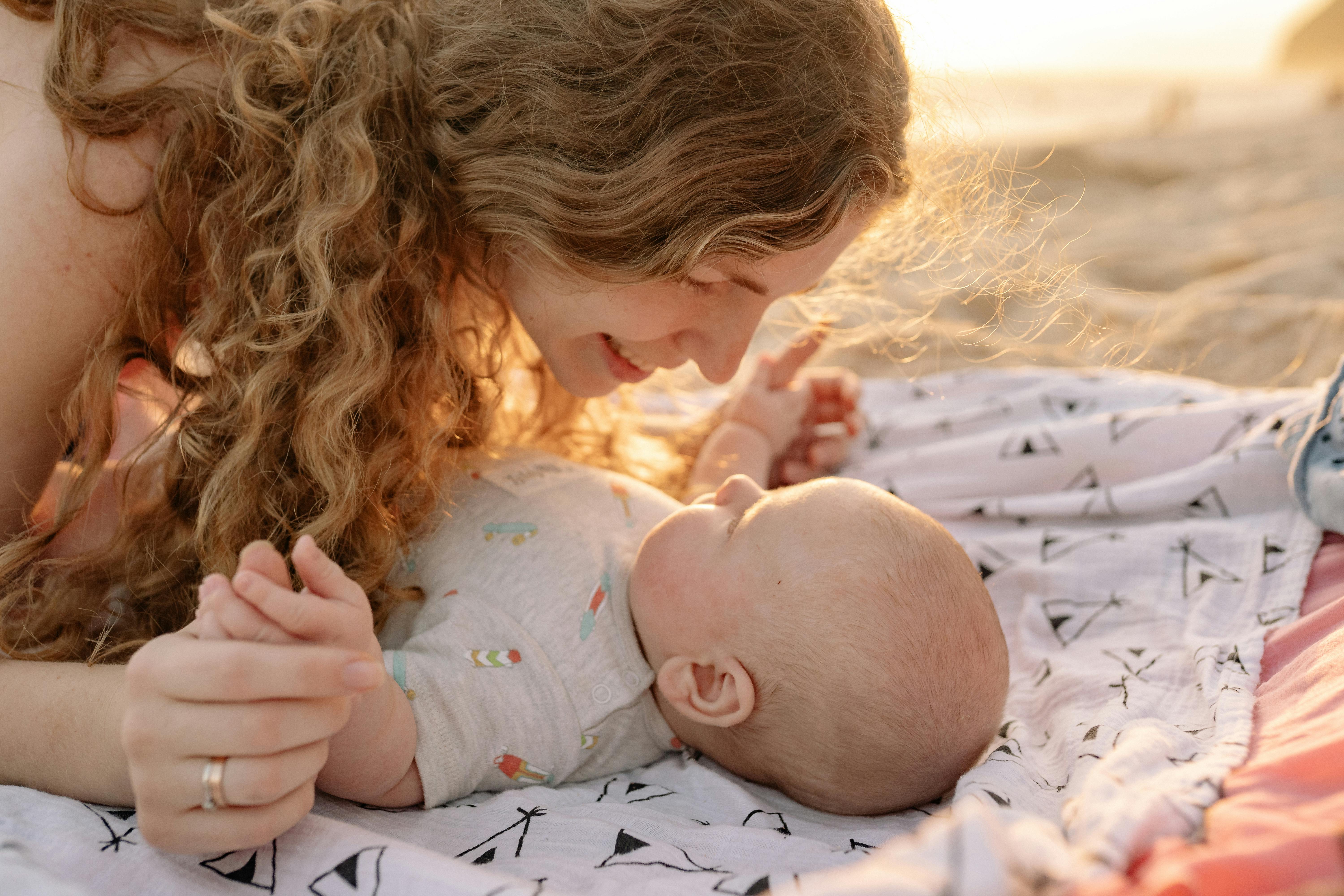 A woman bonding with her baby | Source: Pexels