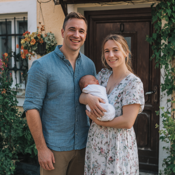 A happy couple with their baby | Source: Midjourney