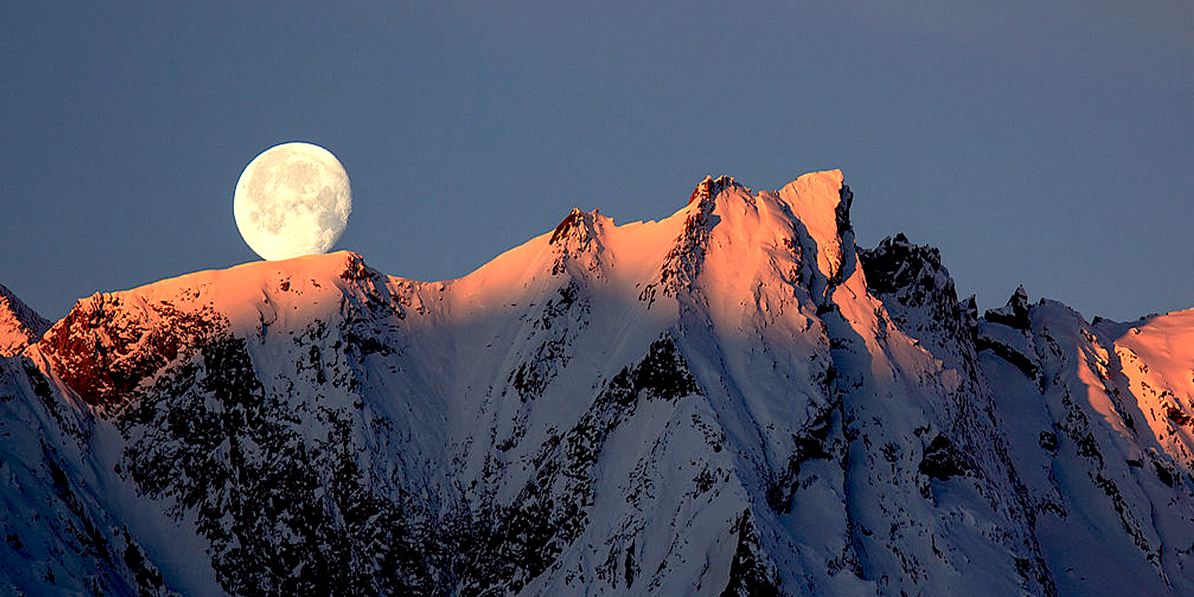 Winter moon set in the Austrian Alps | Source: Getty Images