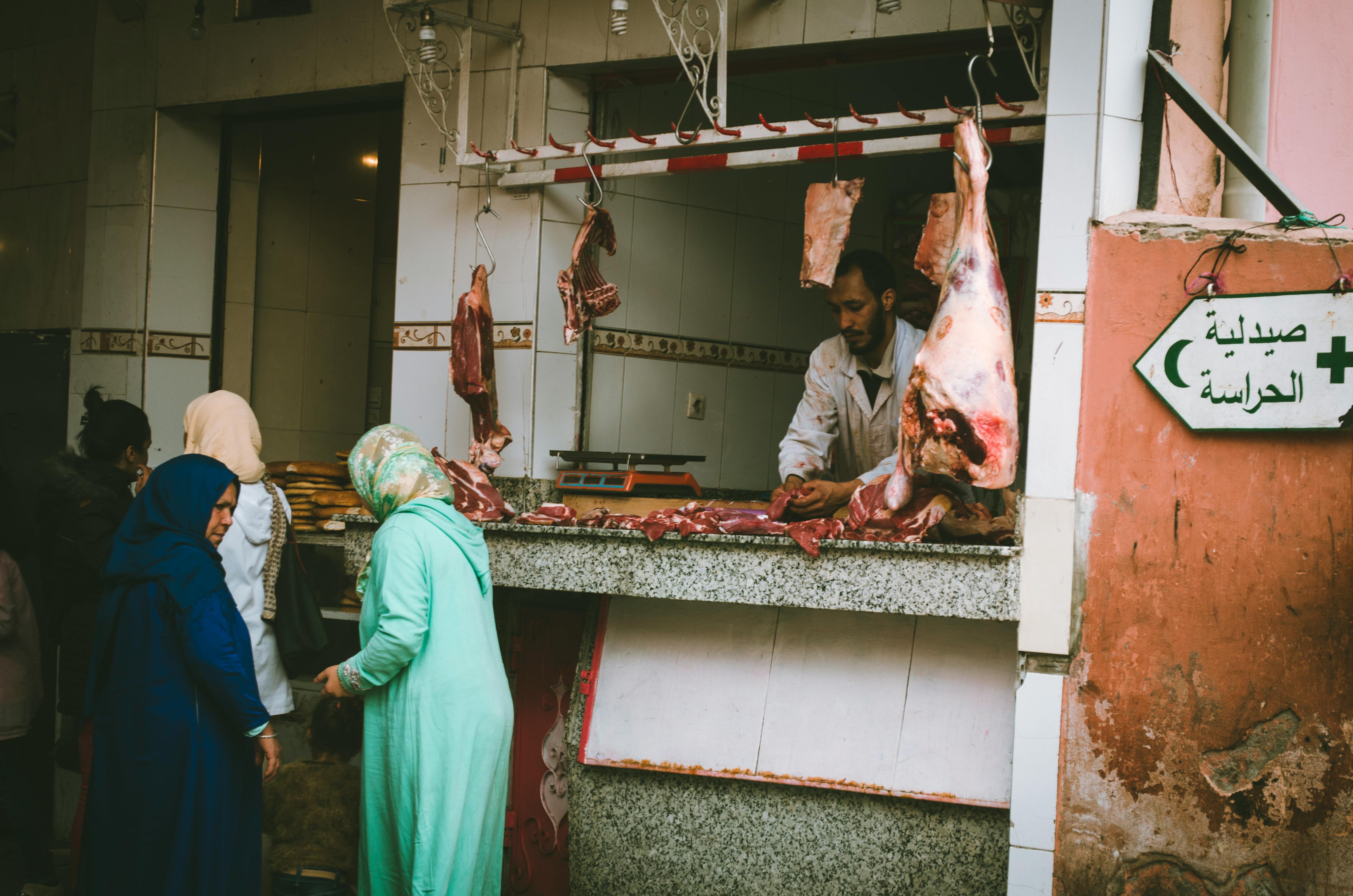 People buying meat at a butchery shop | Source: Pexels