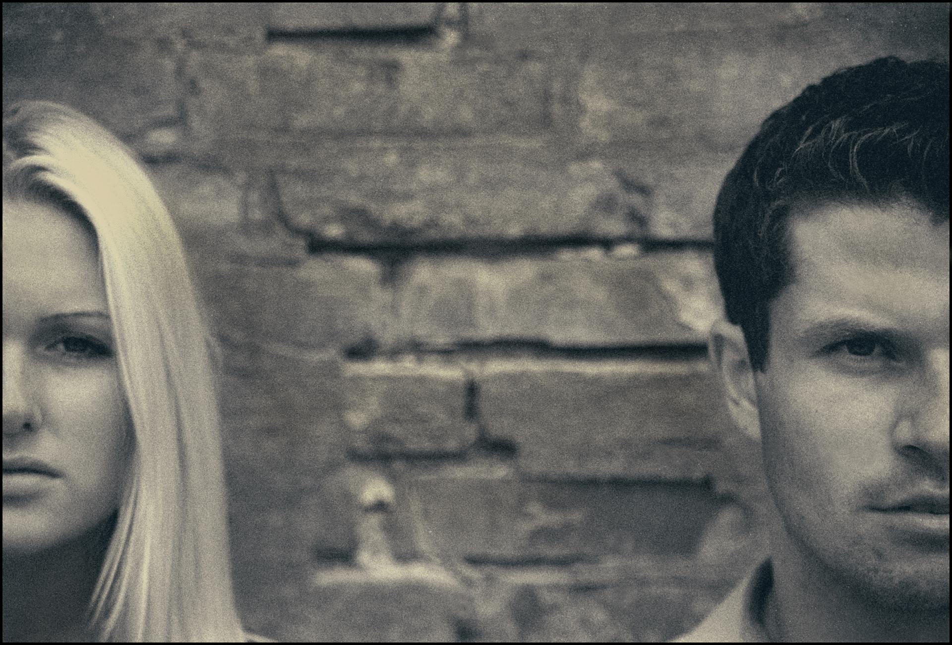 A grayscale photo of a couple standing apart | Source: Pexels