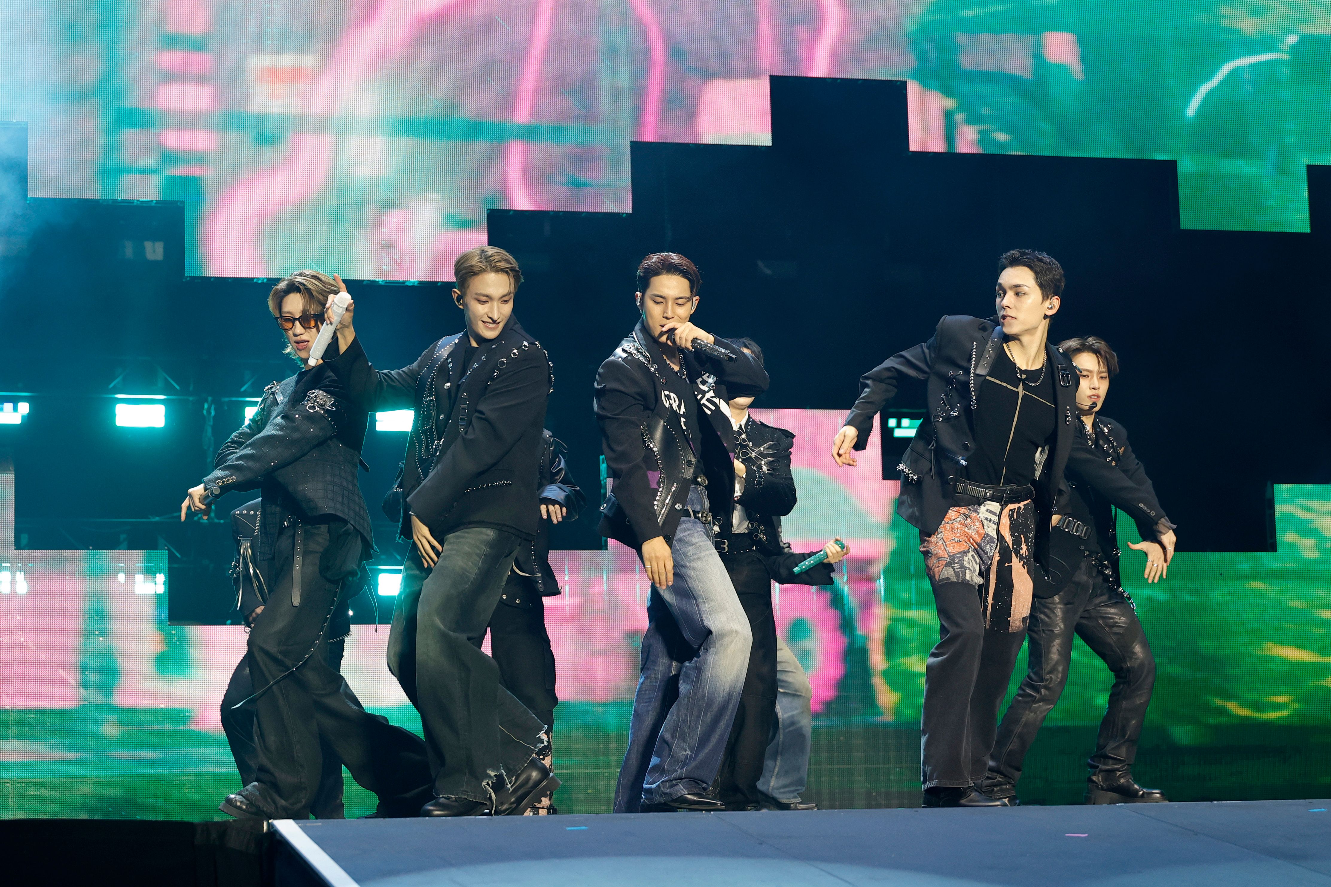 The 8, DK, Mingyu, Vernon and Dino of SEVENTEEN perform onstage at BMO Stadium on October 16, 2025 in Los Angeles, California. | Source: Getty Images