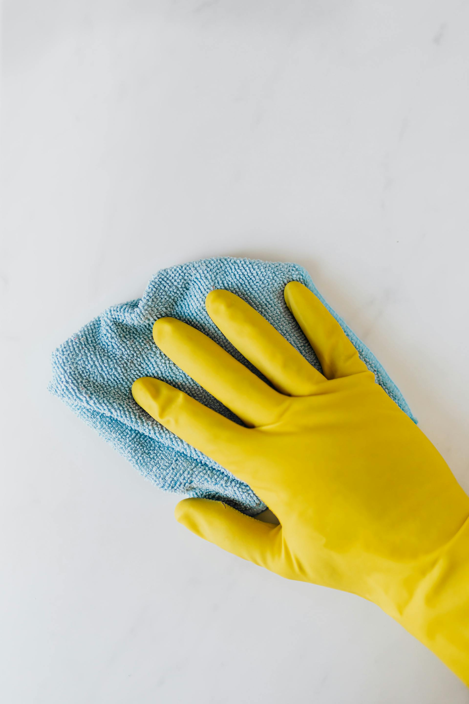 A person wiping a table clean | Source: Pexels