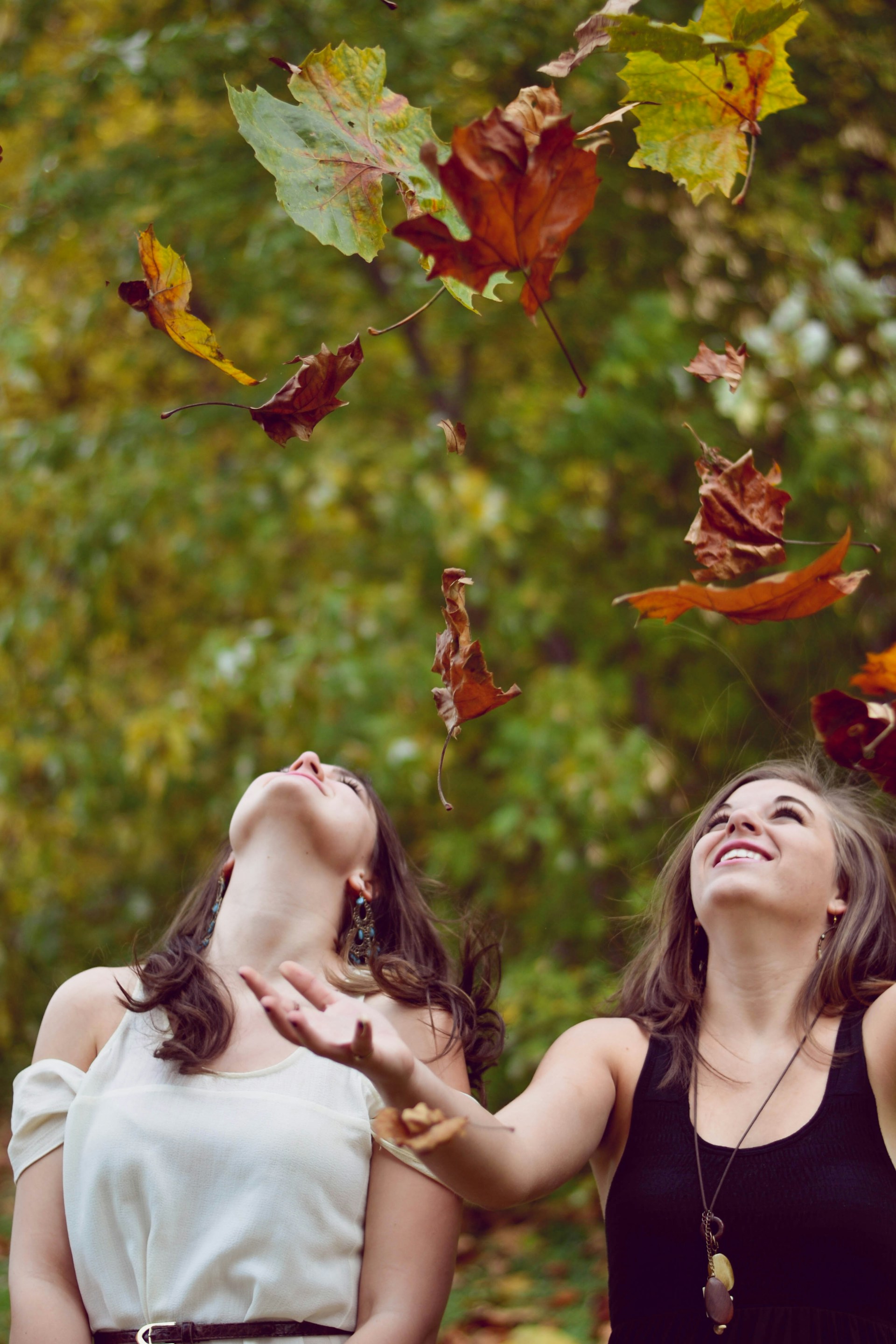 Two delighted women laughing | Source: Unsplash