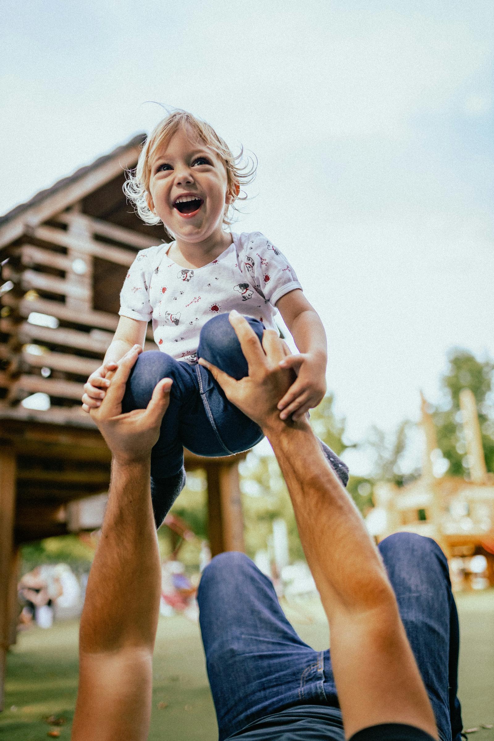 A happy son with his dad | Source: Unsplash