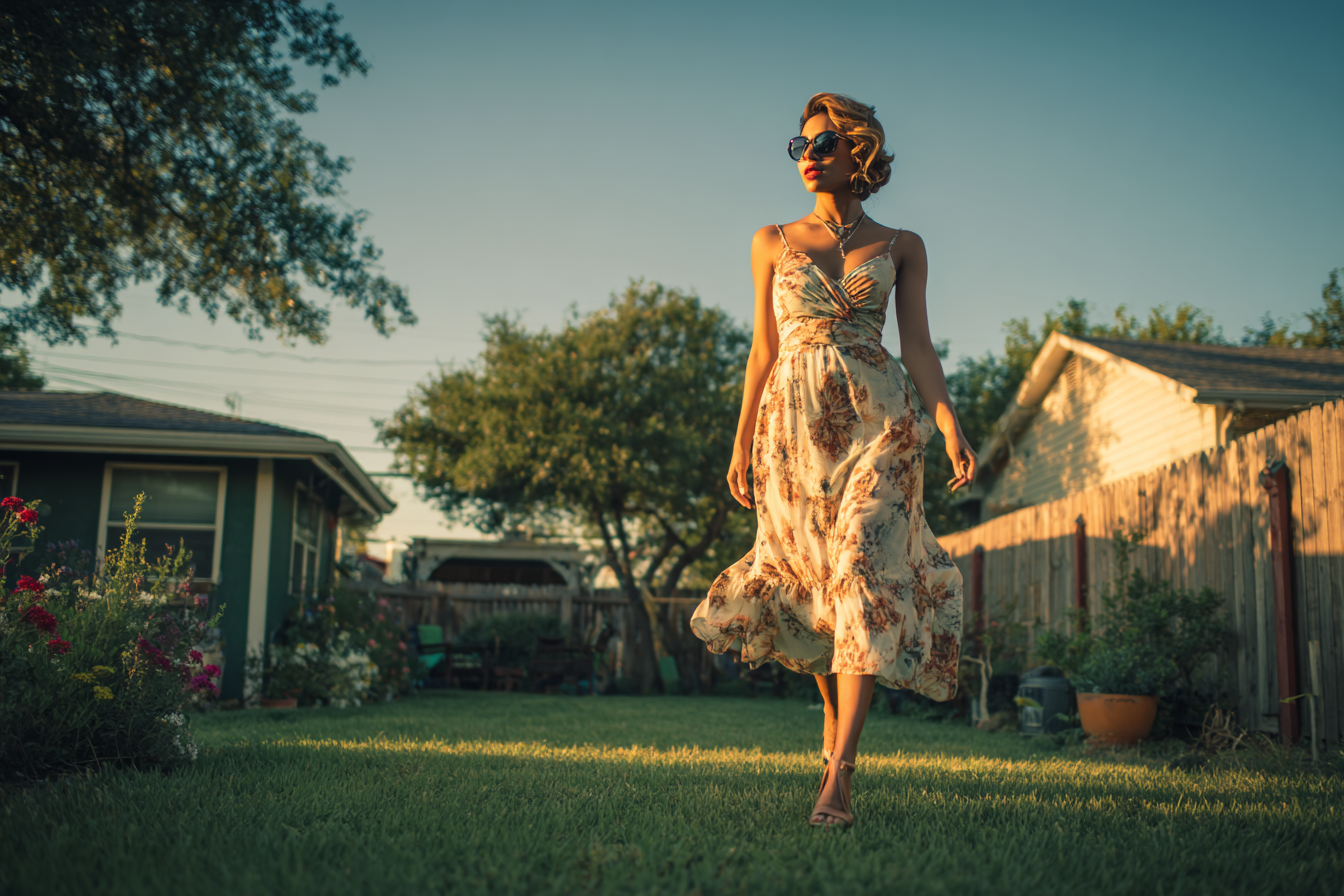 A woman walking across a lawn | Source: Midjourney