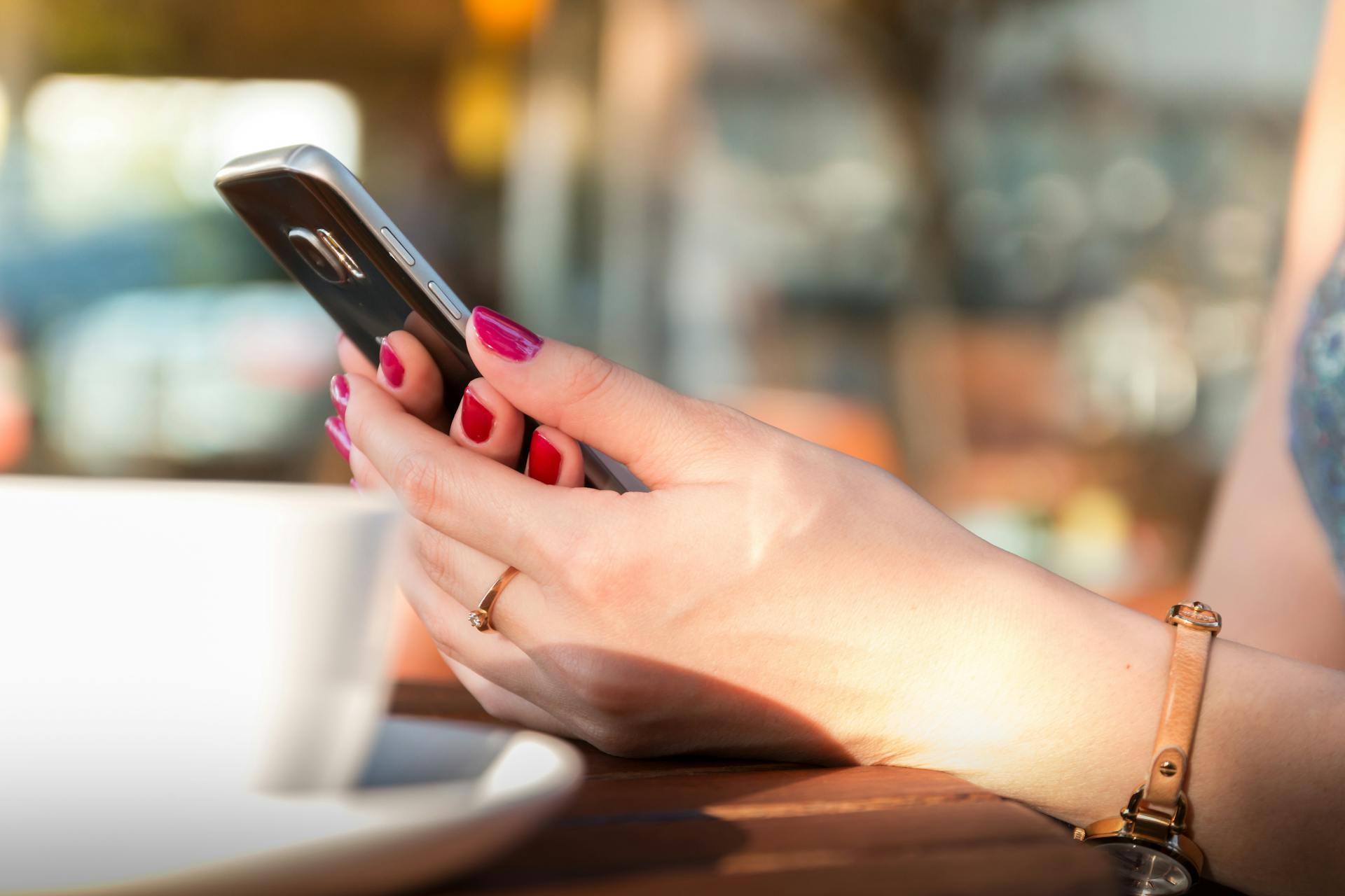 A woman using her phone | Source: Pexels