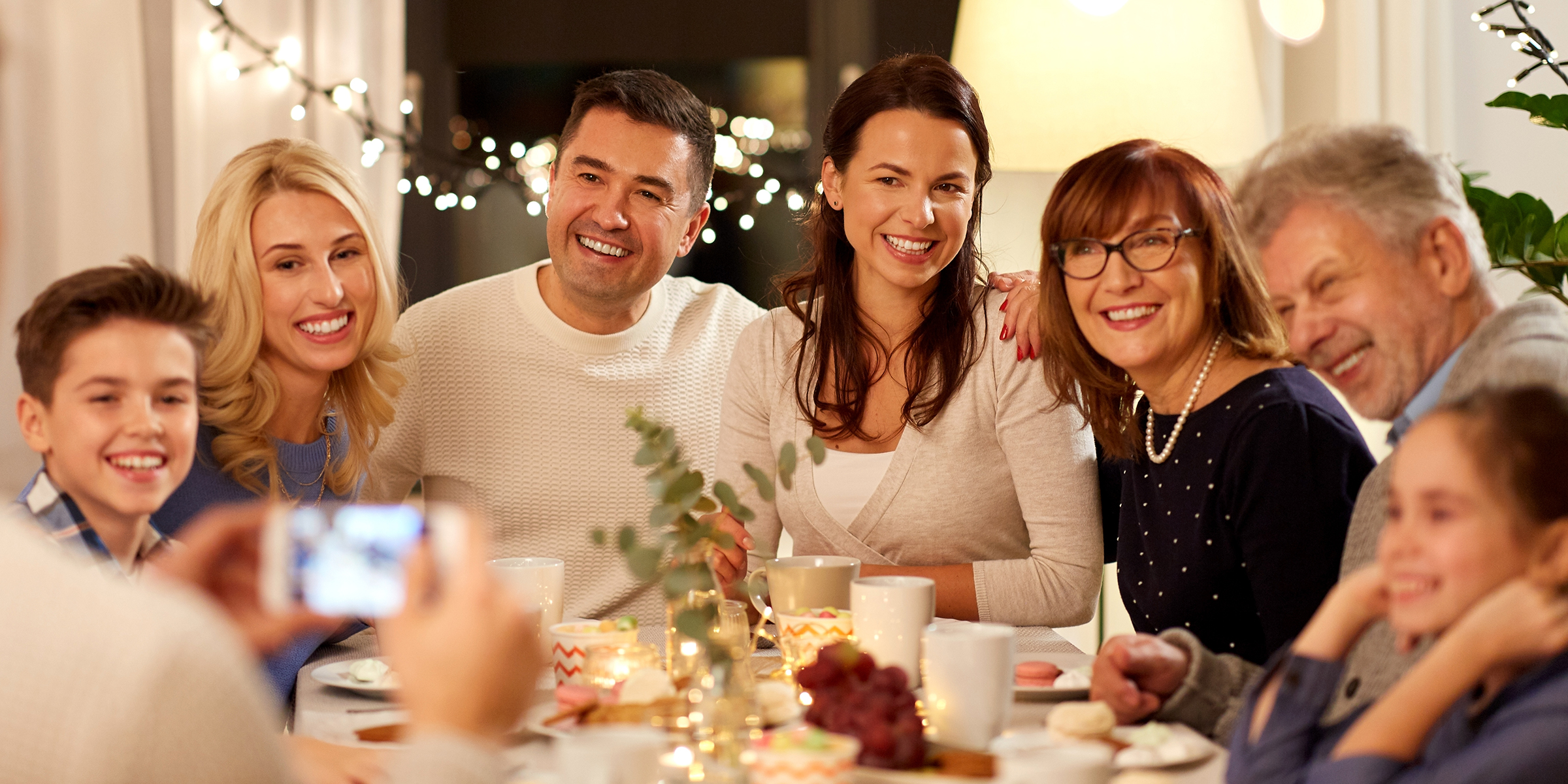 People enjoying family dinner | Source: Shutterstock