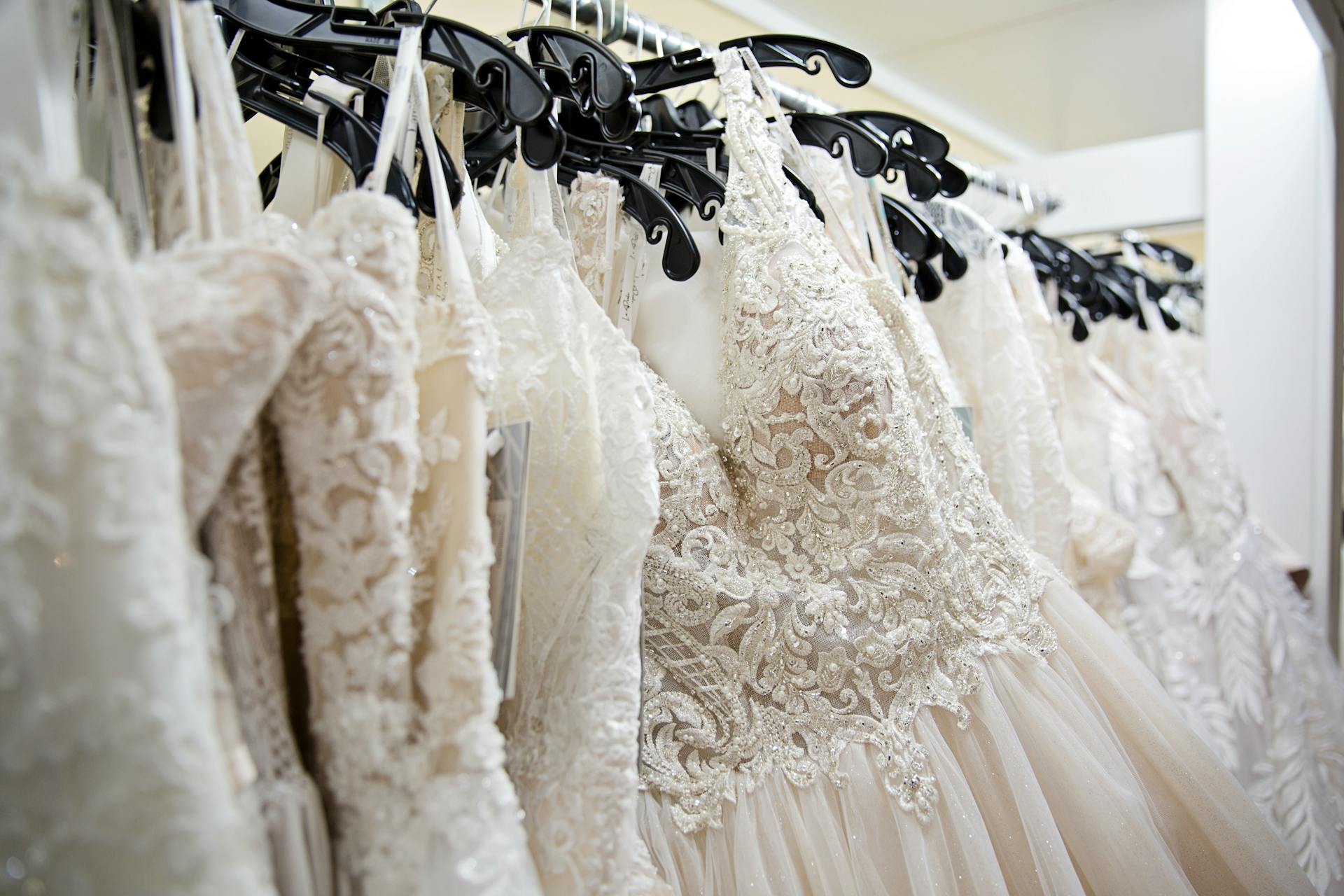 Wedding dresses hanging on a rack | Source: Pexels