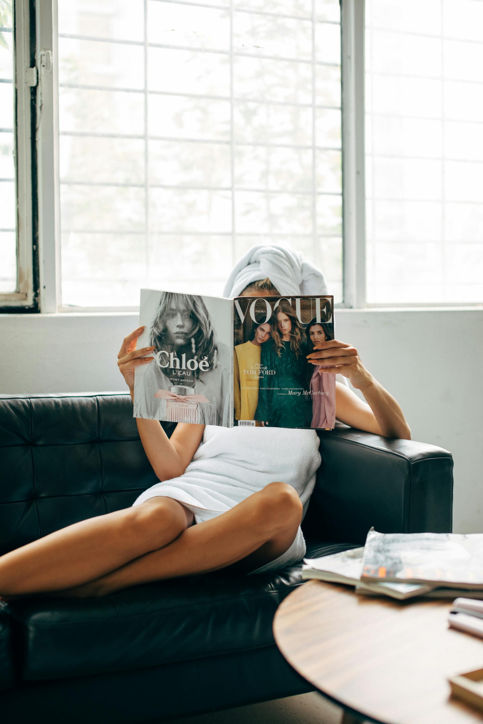 A woman reading a magazine | Source: Pexels