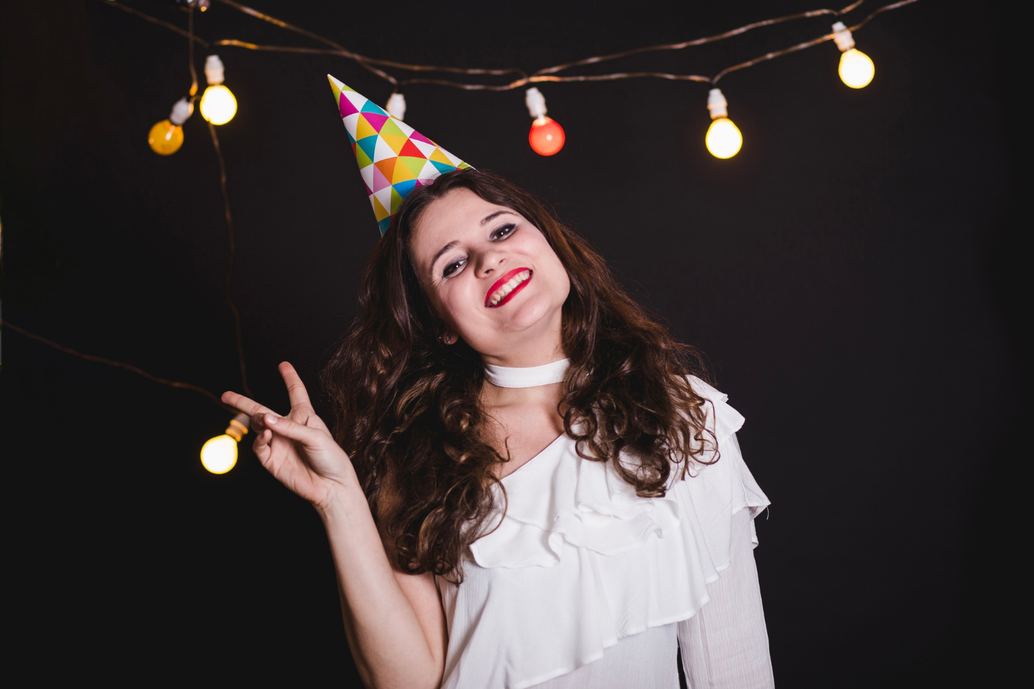 A joyful woman enjoying a party | Source: Freepik