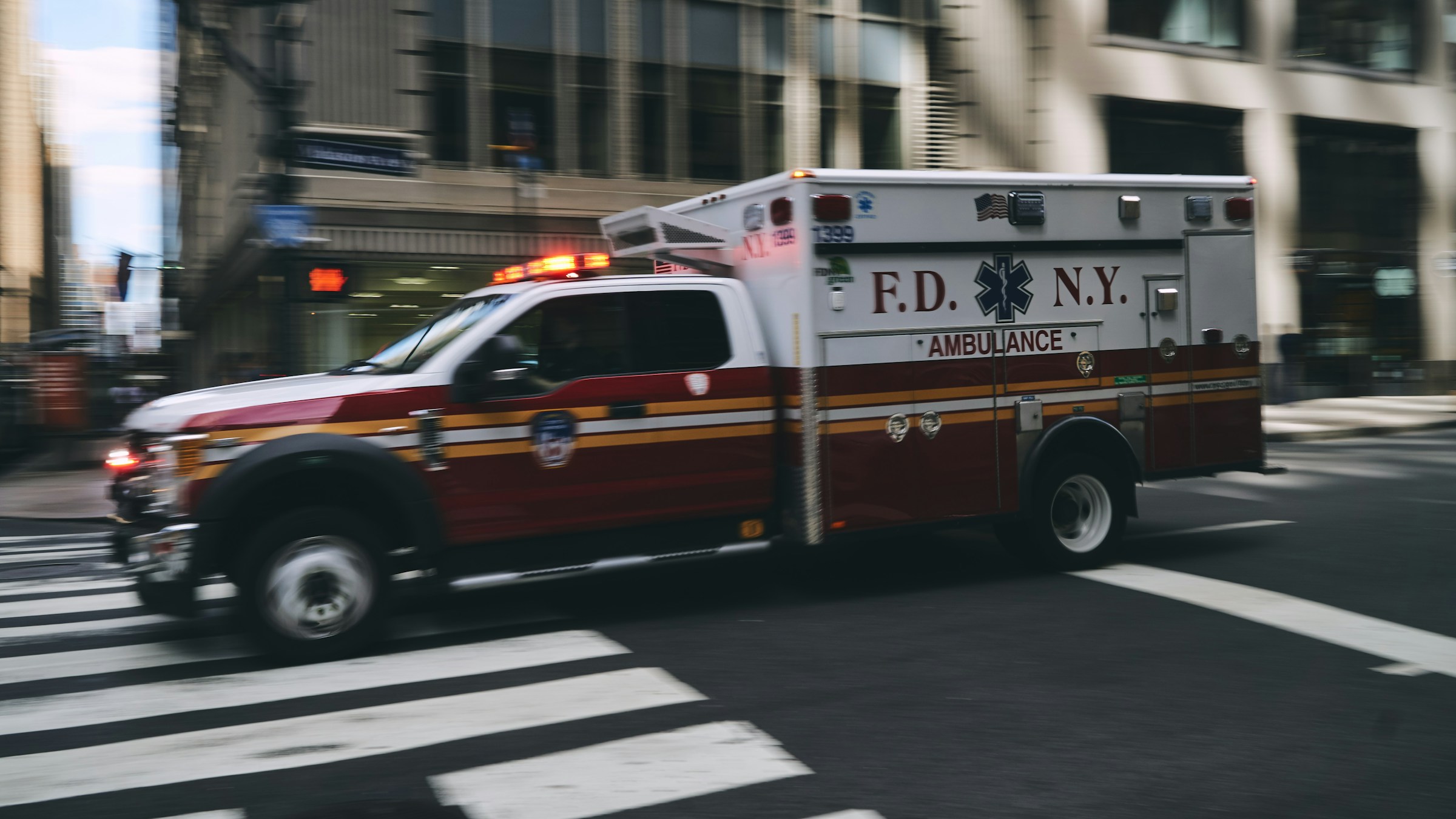 An ambulance speeding across the street | Source: Unsplash