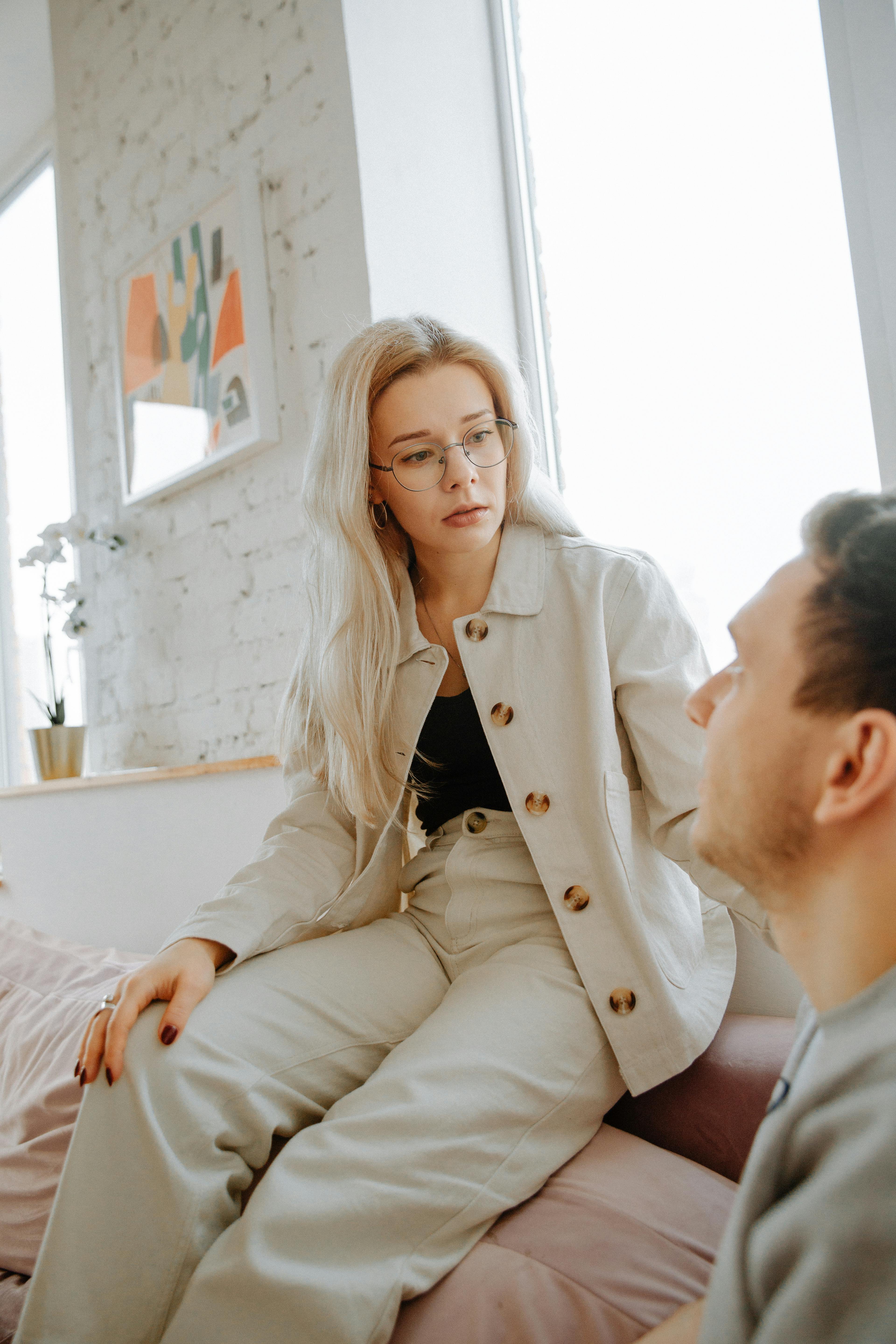 A woman looking distant while interacting with a man | Source: Pexels