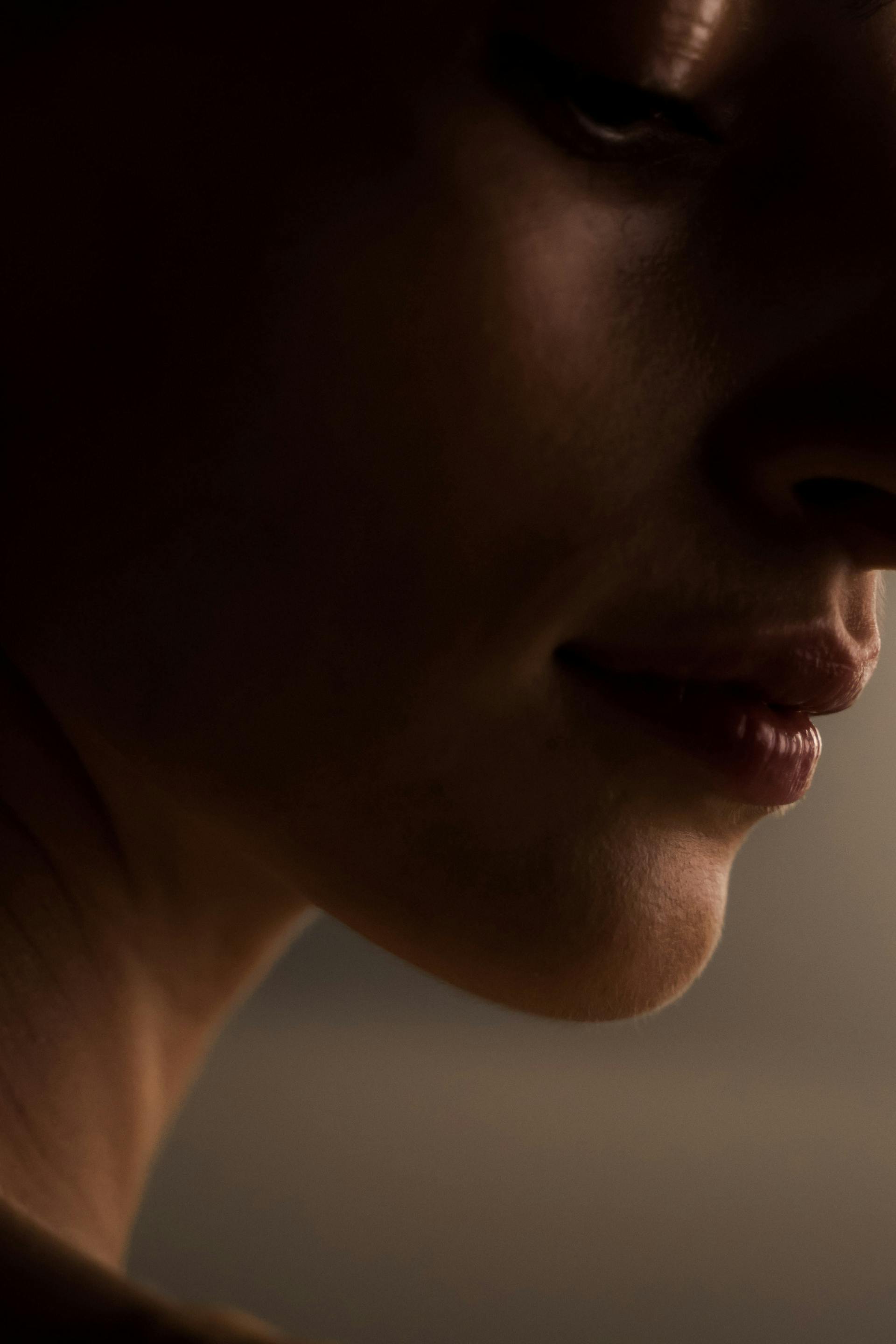 A woman's face in shadow | Source: Pexels