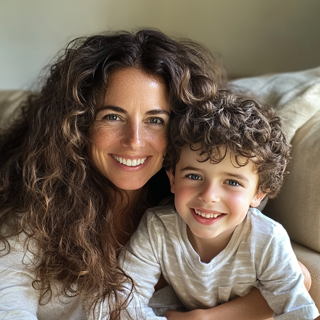 A woman and her son sitting on a couch | Source: Midjourney