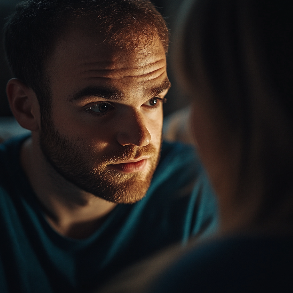 A man looking to the side while talking to his wife | Source: Midjourney