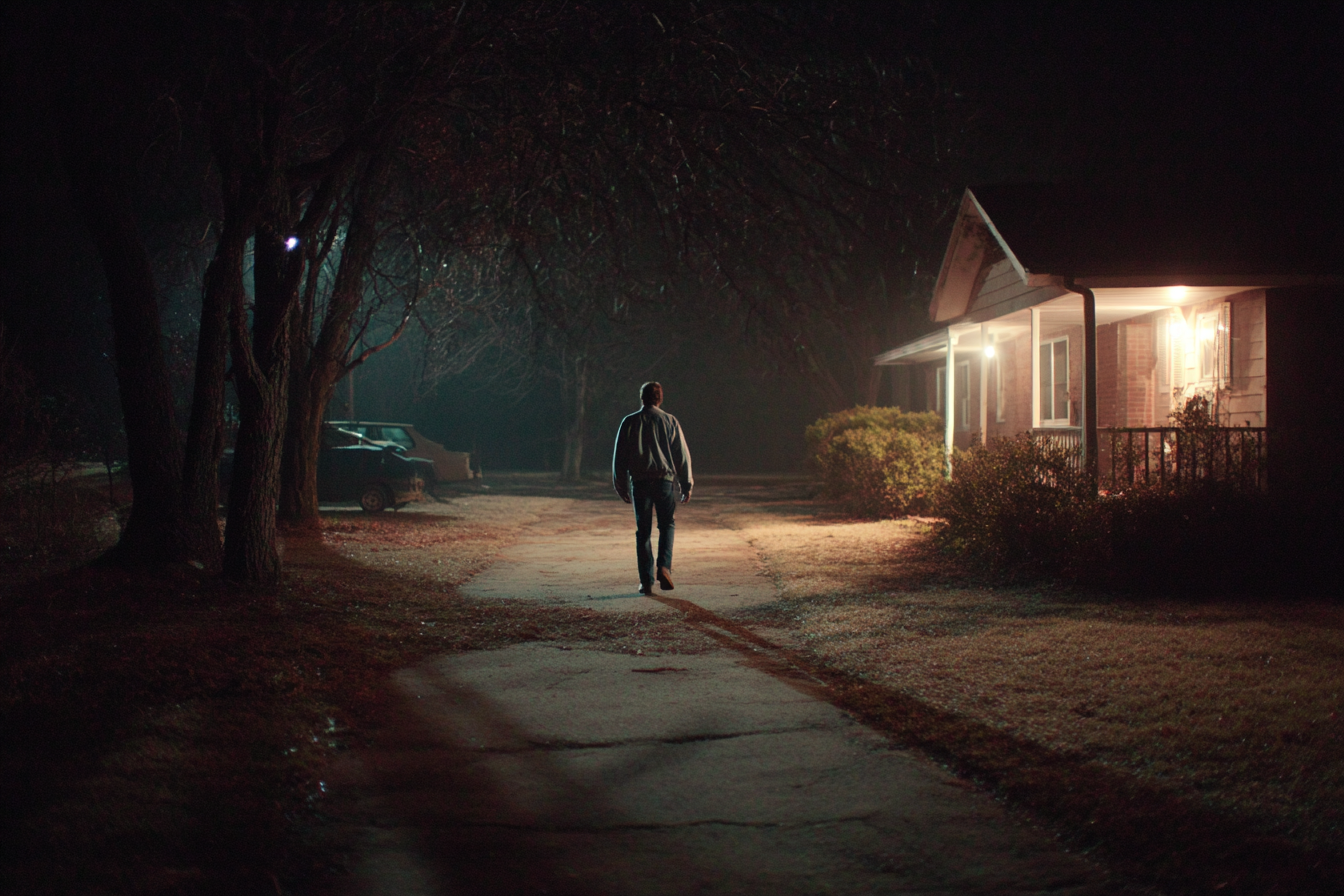 A man walking back to his house | Source: Midjourney