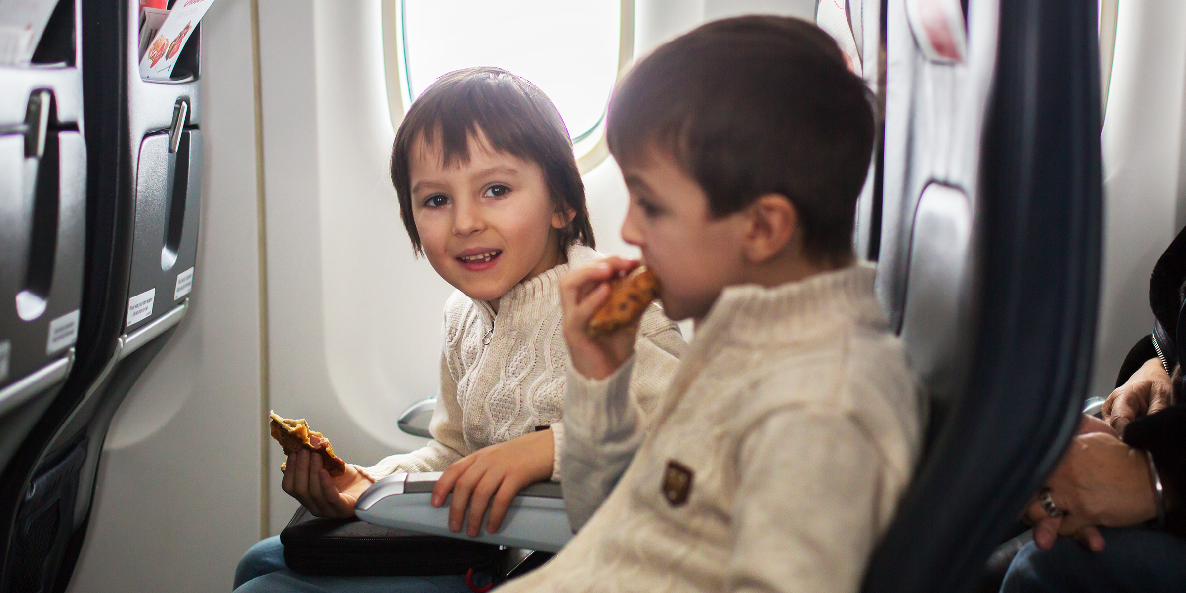 Children on a plane | Source: Shutterstock