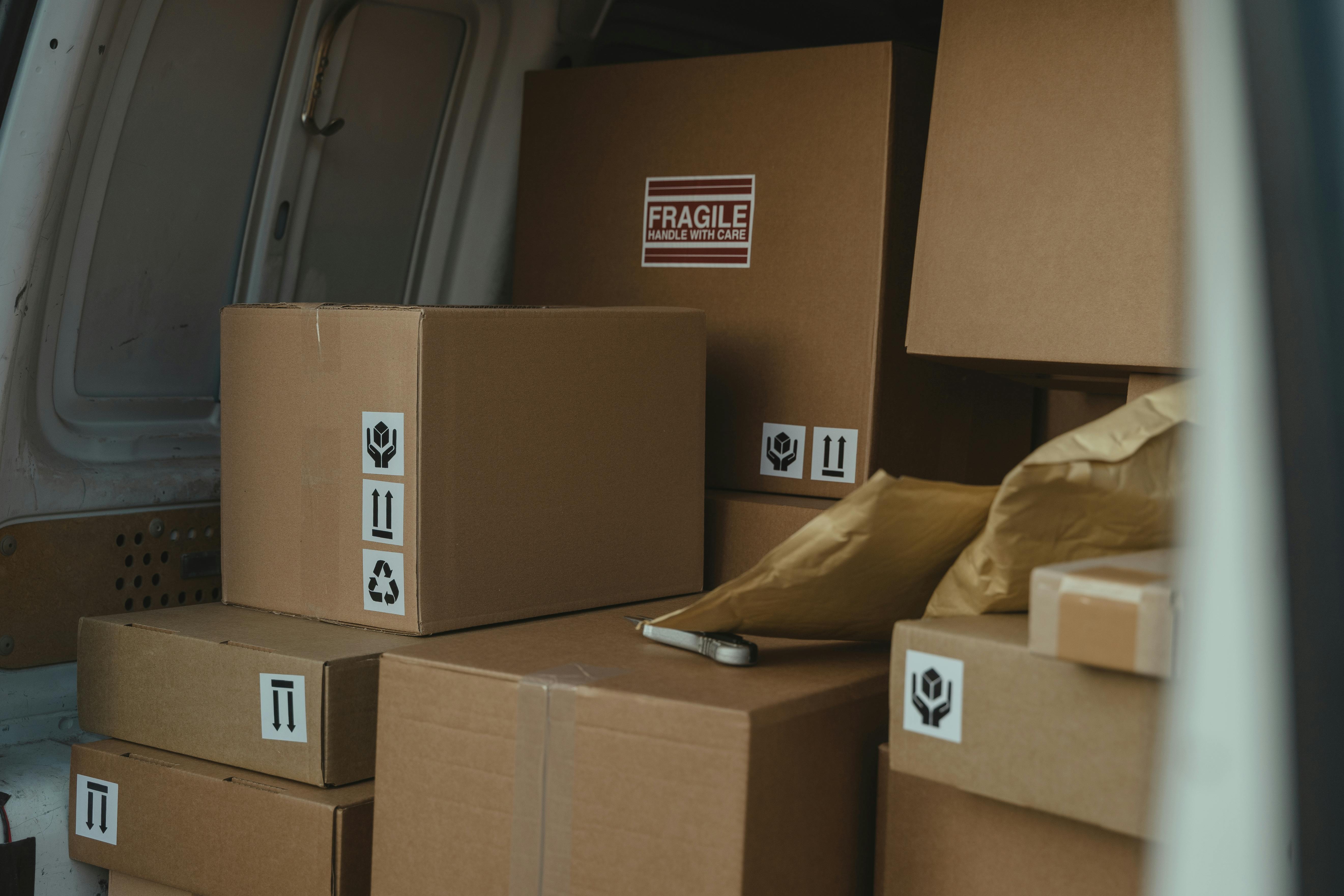 Sealed boxes in the back of a van | Source: Pexels