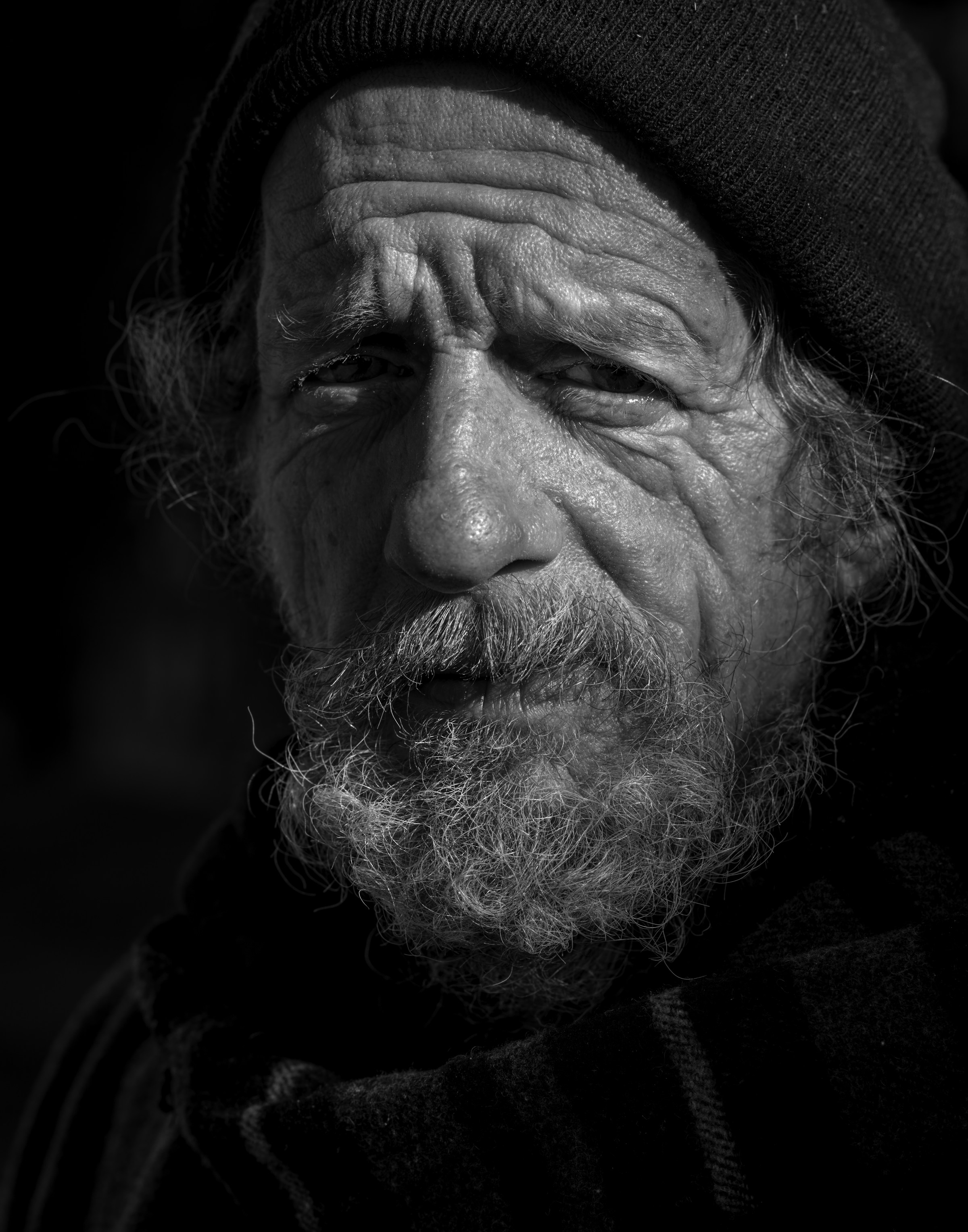 A black and white photo of an elderly man | Source: Unsplash