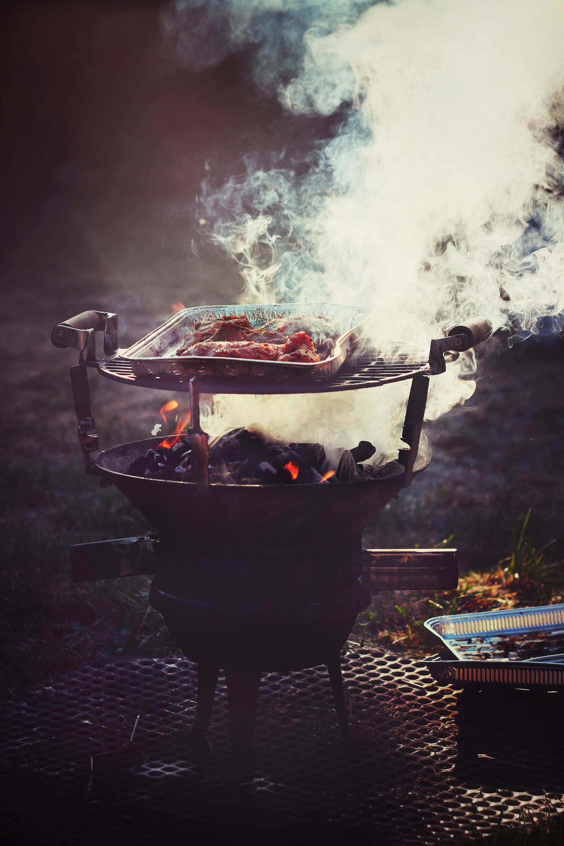 Smoke emanating from a BBQ grill | Source: Unsplash