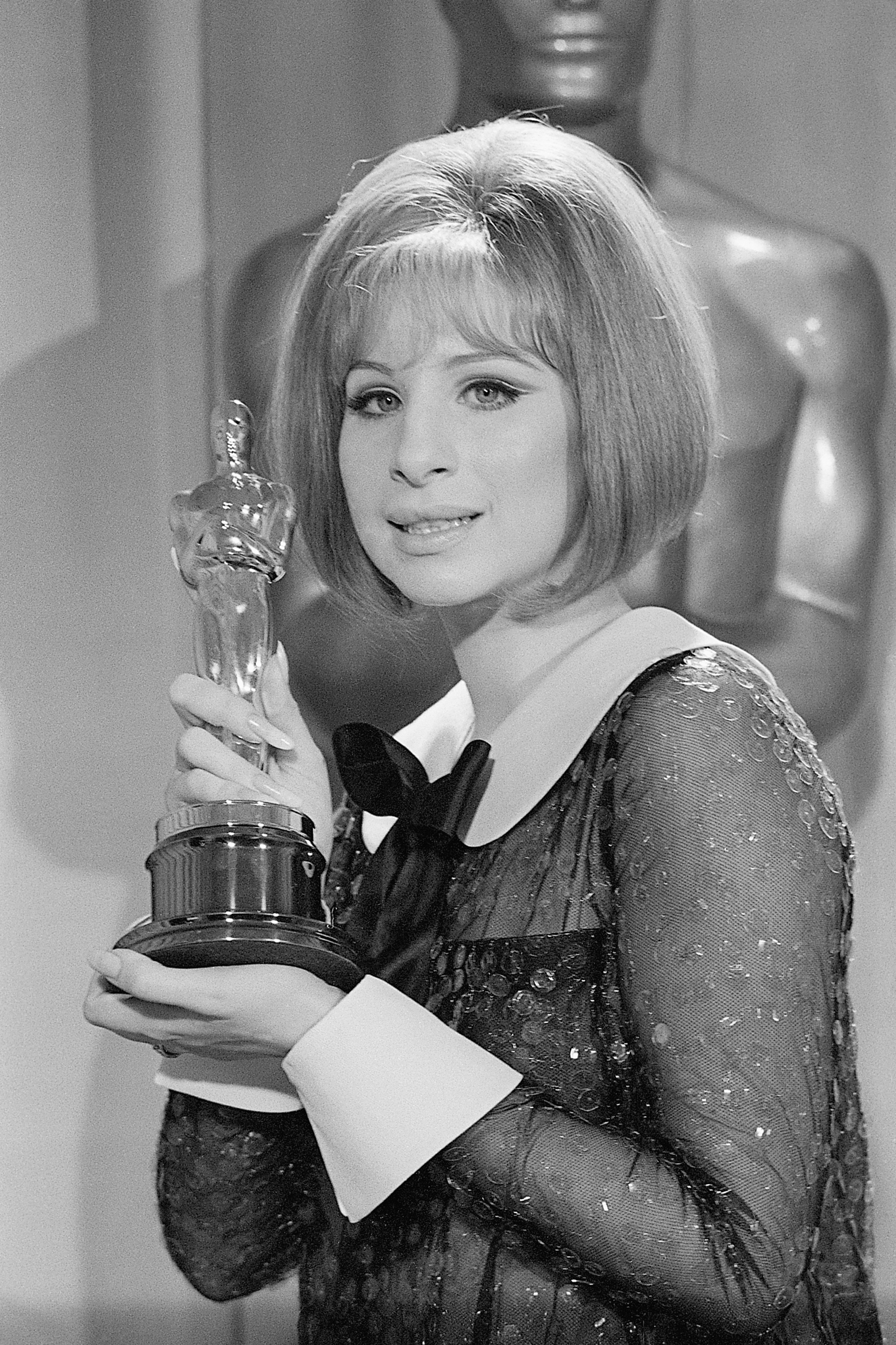Barbra Streisand holds her "Oscar" after she was named co-winner of the Best Actress Award in the 41st Annual Academy Awards on April 14, 1969. | Source: Getty Images