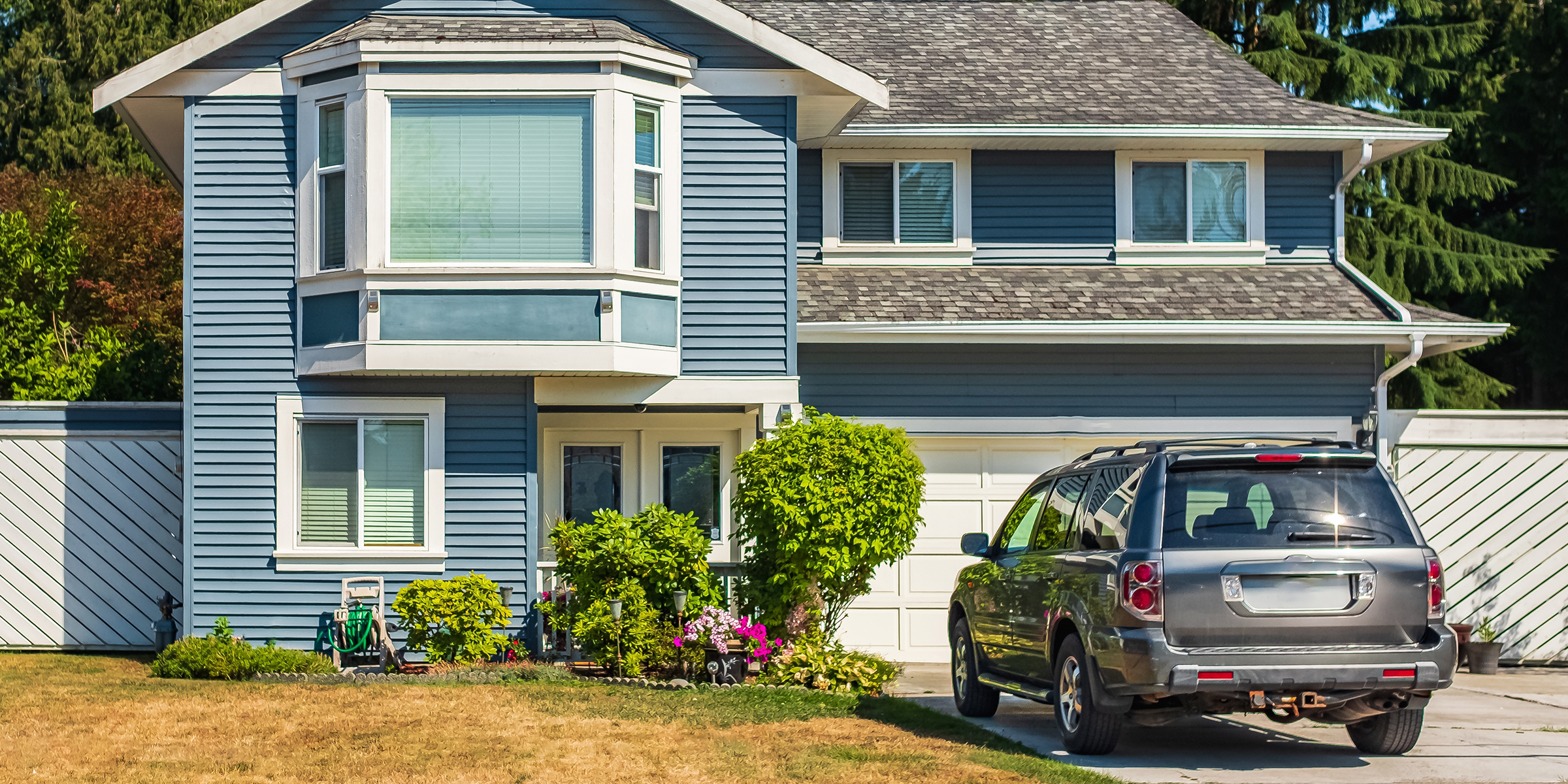 A car outside a house | Source: Shutterstock