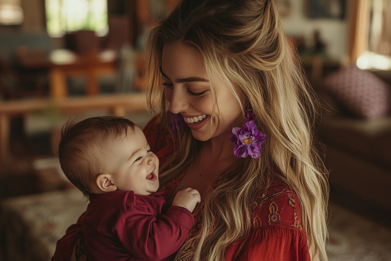 A woman smiling while holding a laughing baby | Source: Midjourney