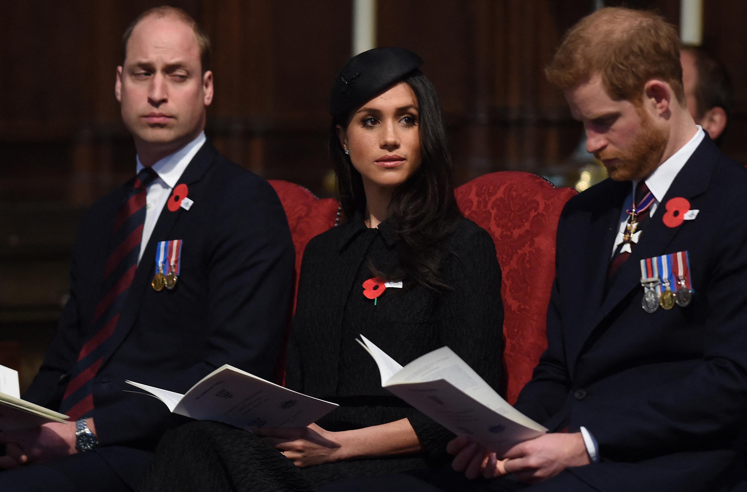 Prince William, Meghan Markle, and Prince Harry attend a service of commemoration and thanksgiving to mark Anzac Day in Westminster Abbey in London on April 25, 2018. | Source: Getty Images