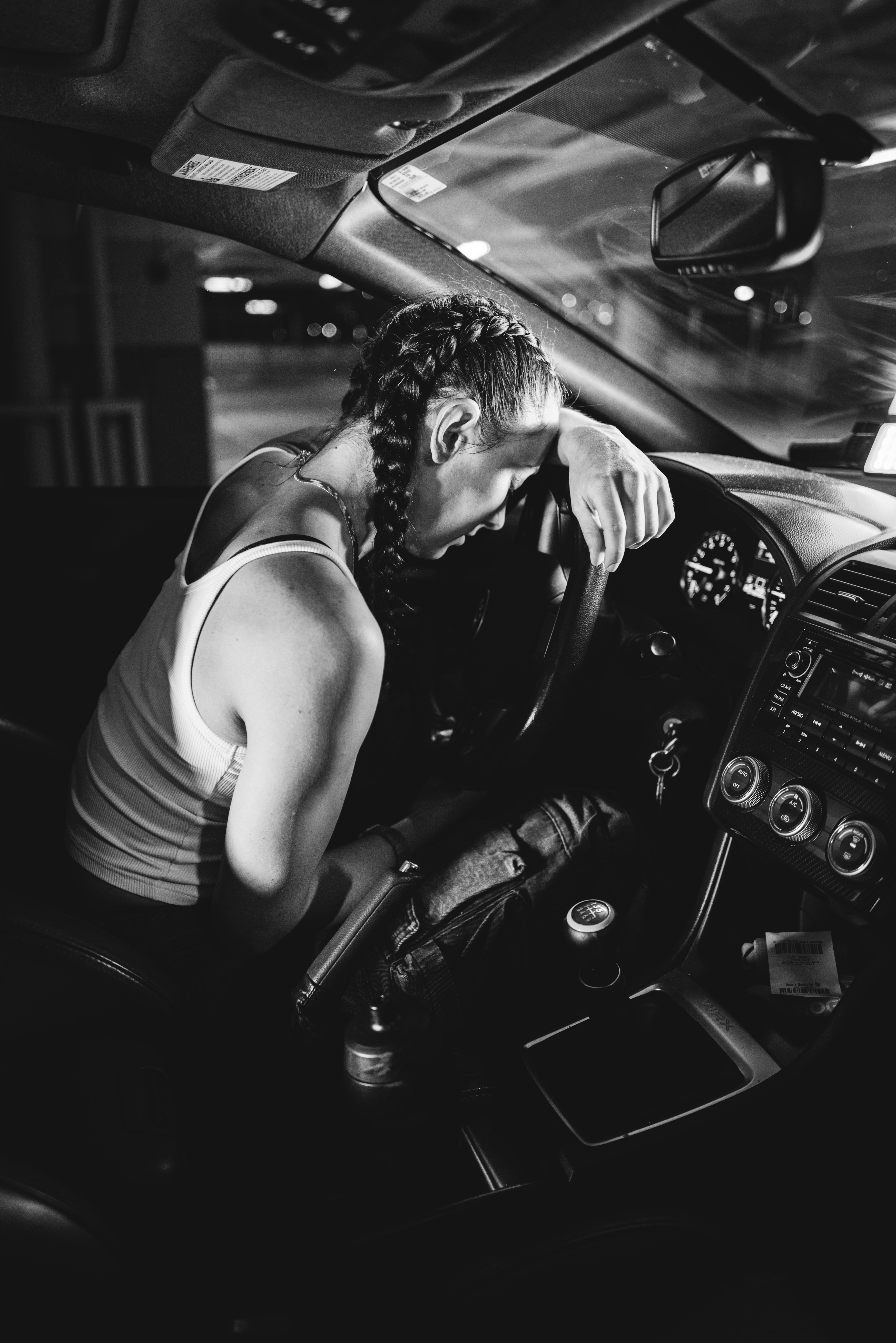 A stressed woman sitting in a car | Source: Pexels