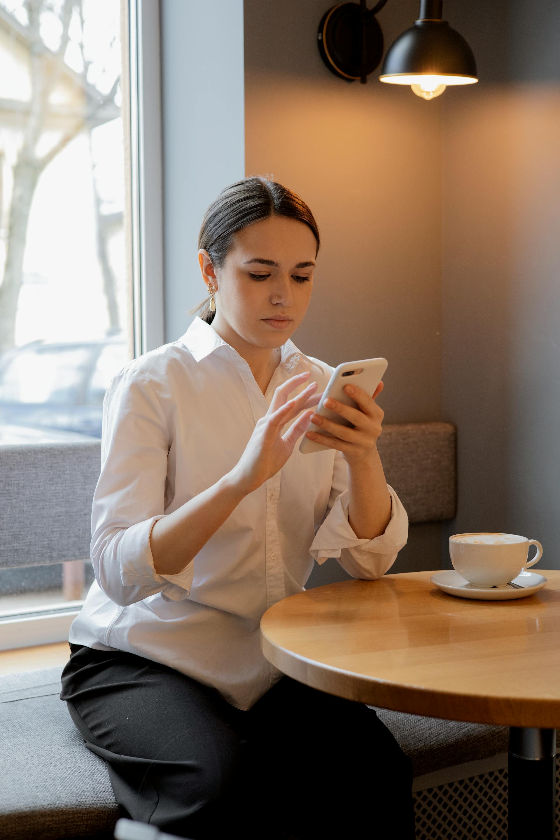 A woman on her phone | Source: Pexels