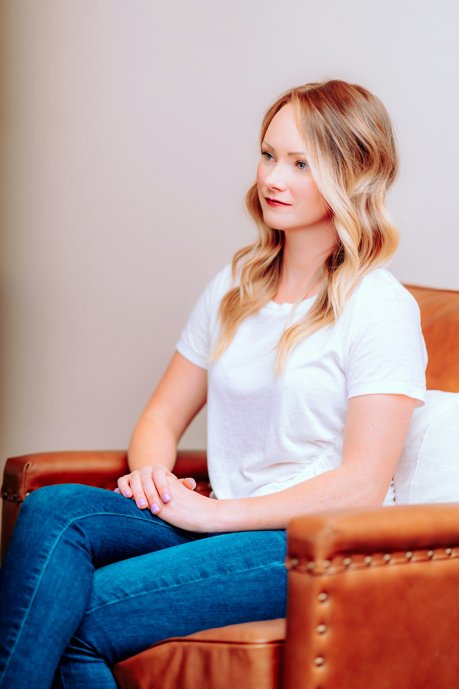 A woman sitting on the couch | Source: Unsplash