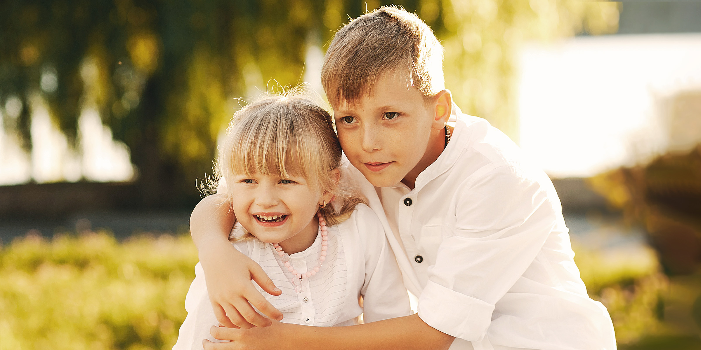 A girl standing with her brother | Source: Freepik