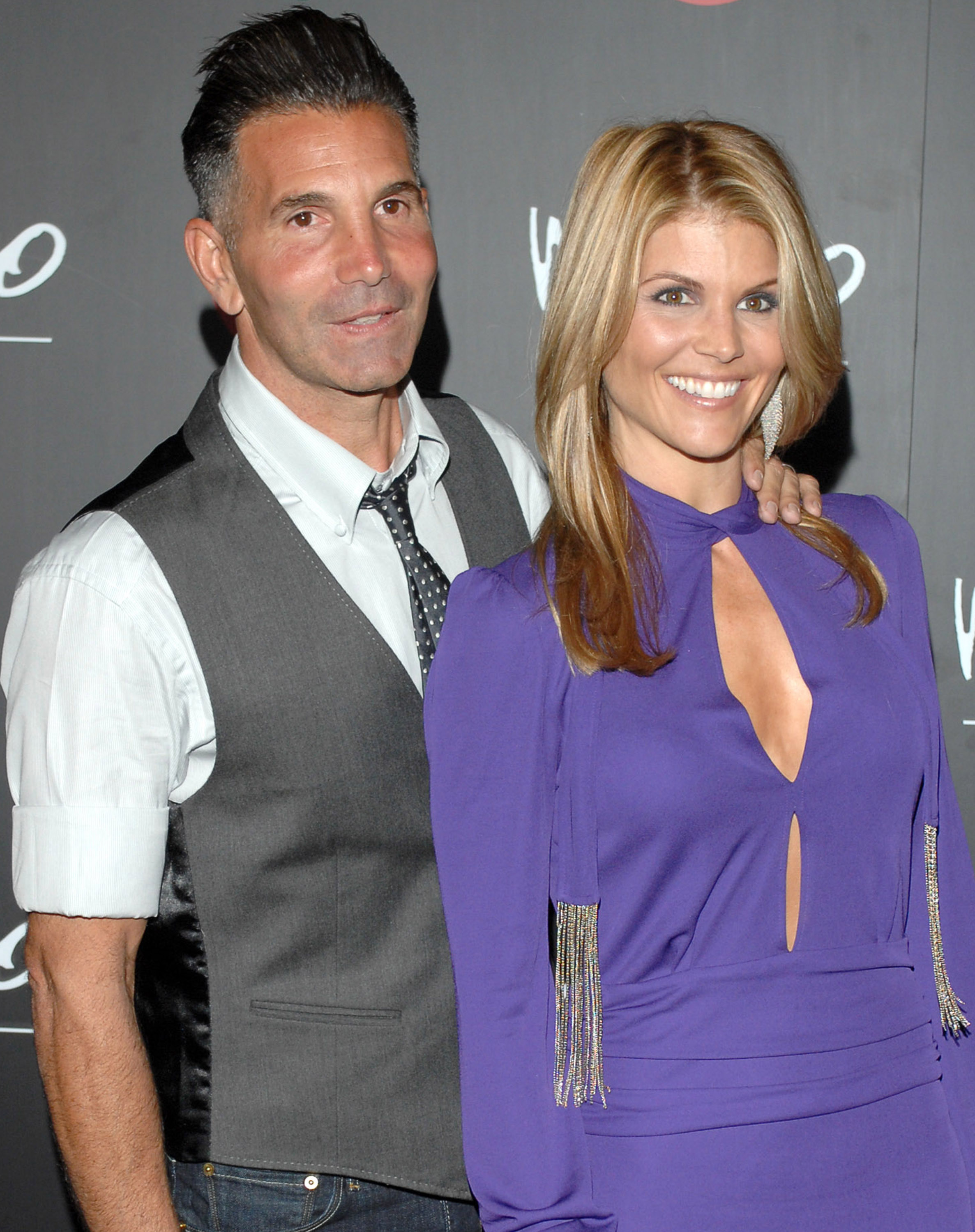 Mossimo Giannulli and Lori Loughlin pose at Target Hosts LA Fashion Week Party for Designer Mossimo Giannulli on October 19, 2006. | Source: Getty Images