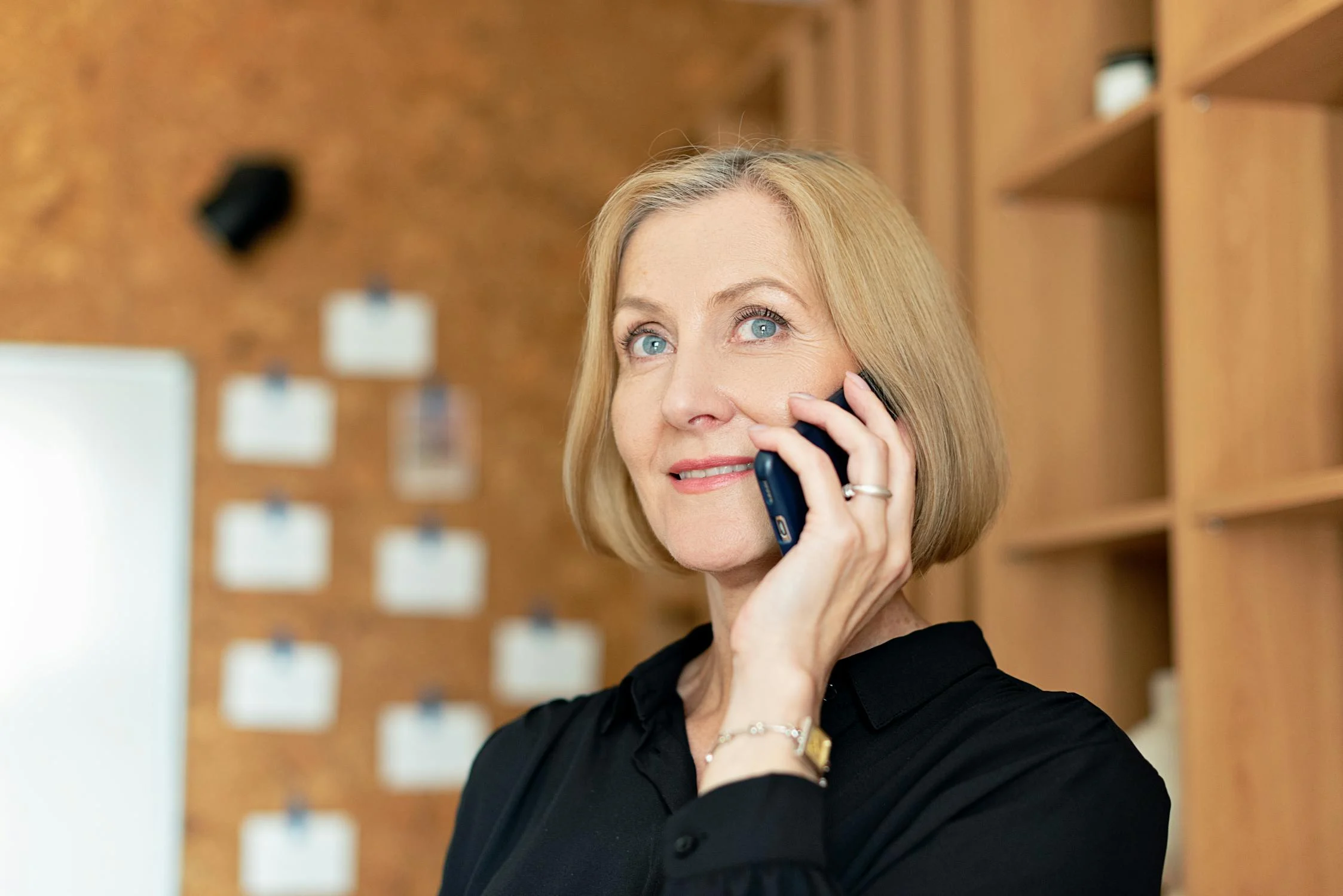 A mature woman talking on her phone | Source: Pexels