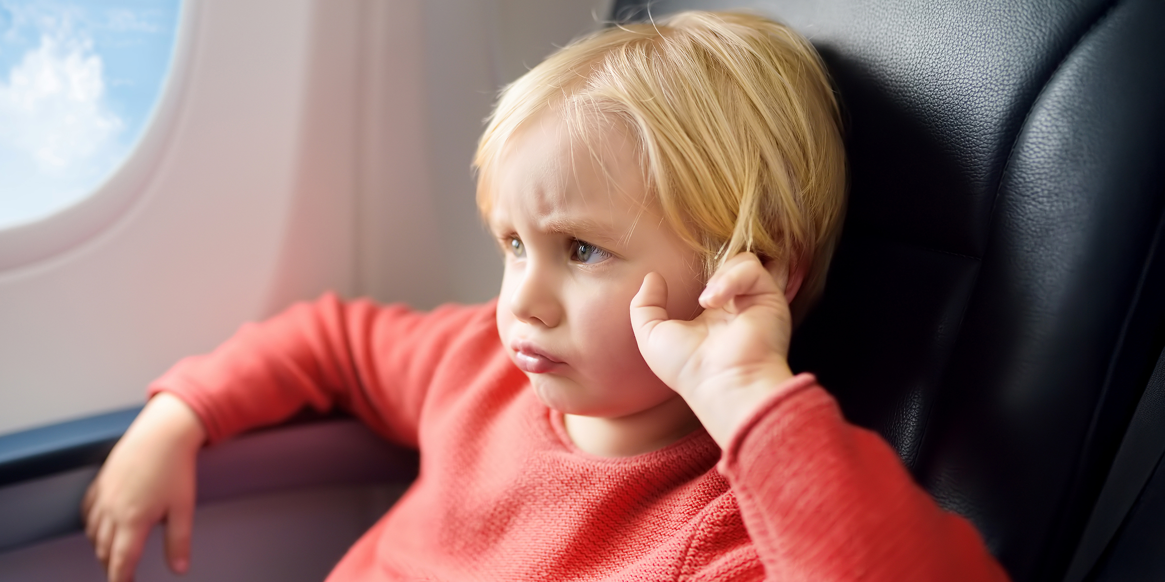 A child in an airplane | Source: Shutterstock