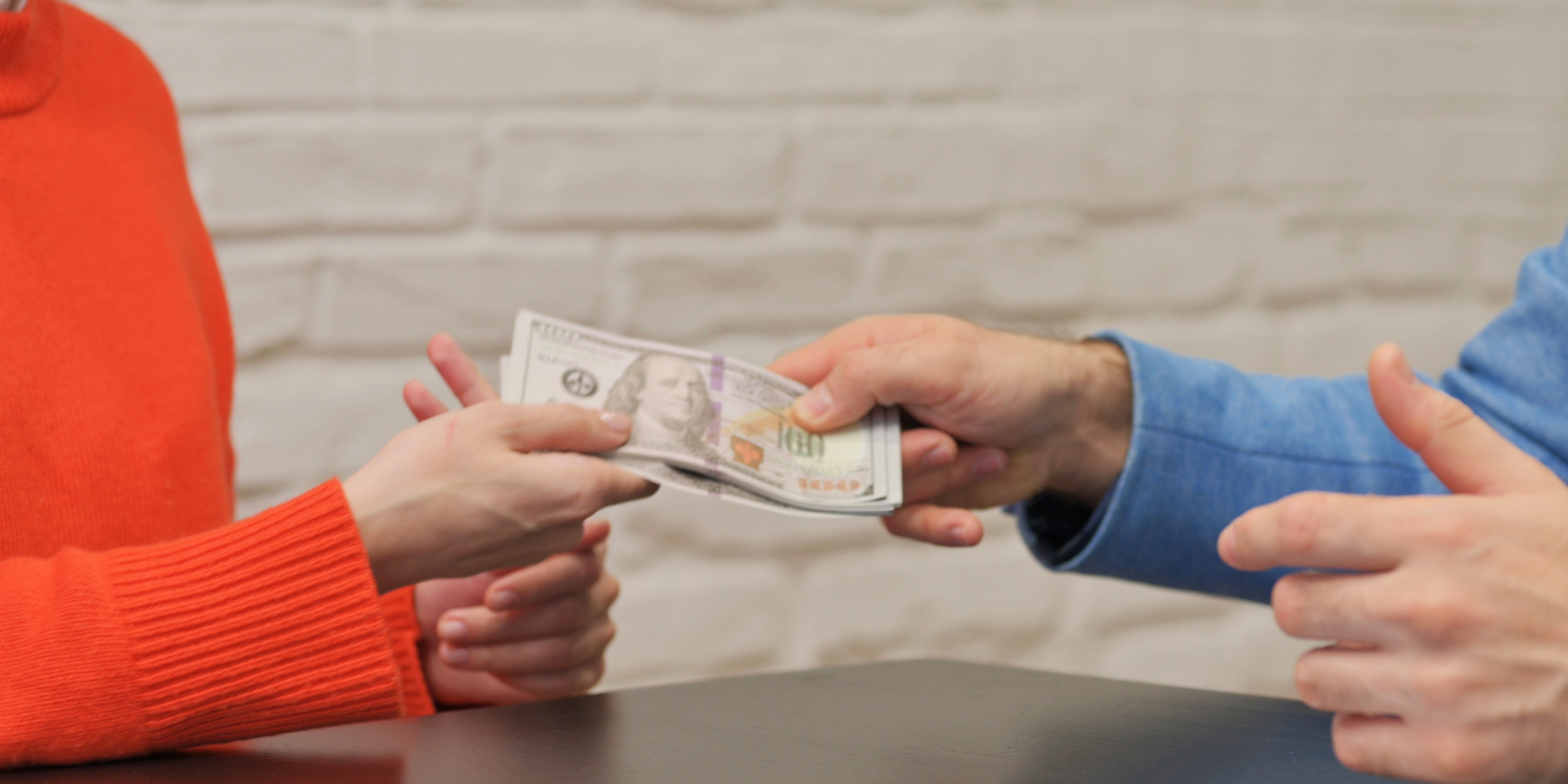 People exchanging money | Source: Shutterstock