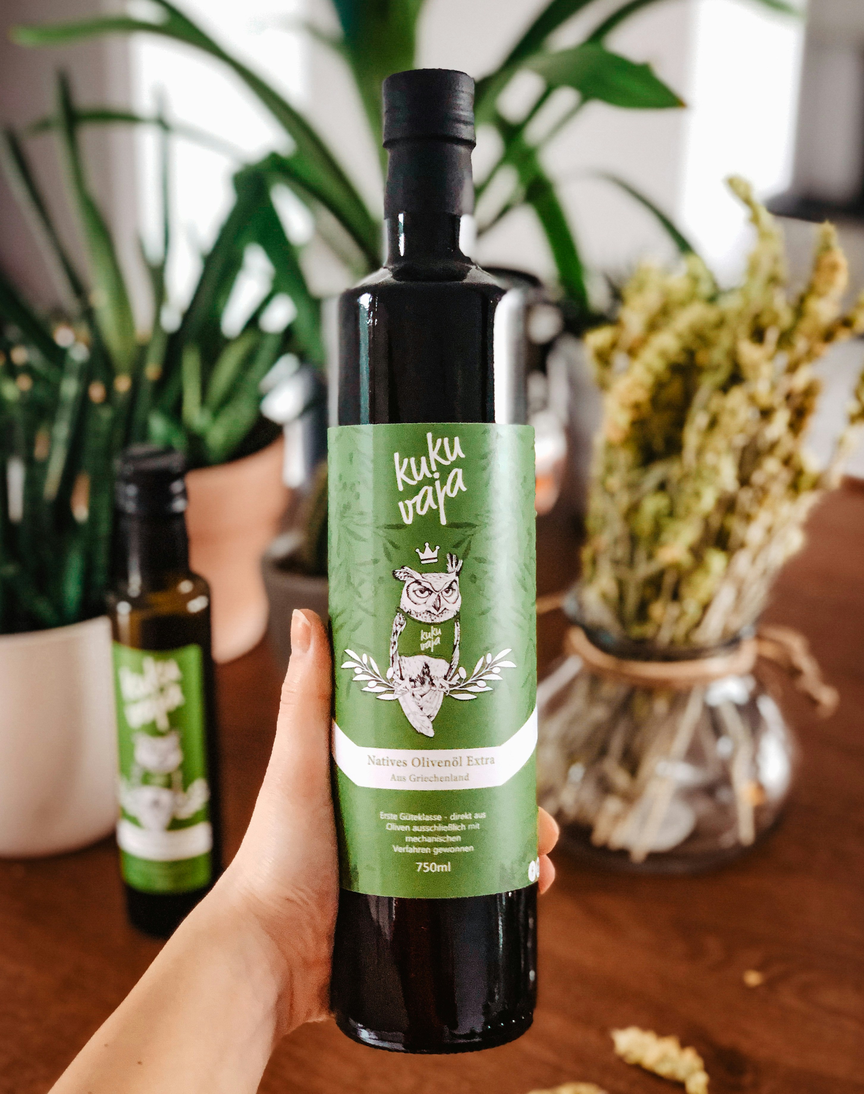 A person holding a bottle of olive oil | Source: Unsplash