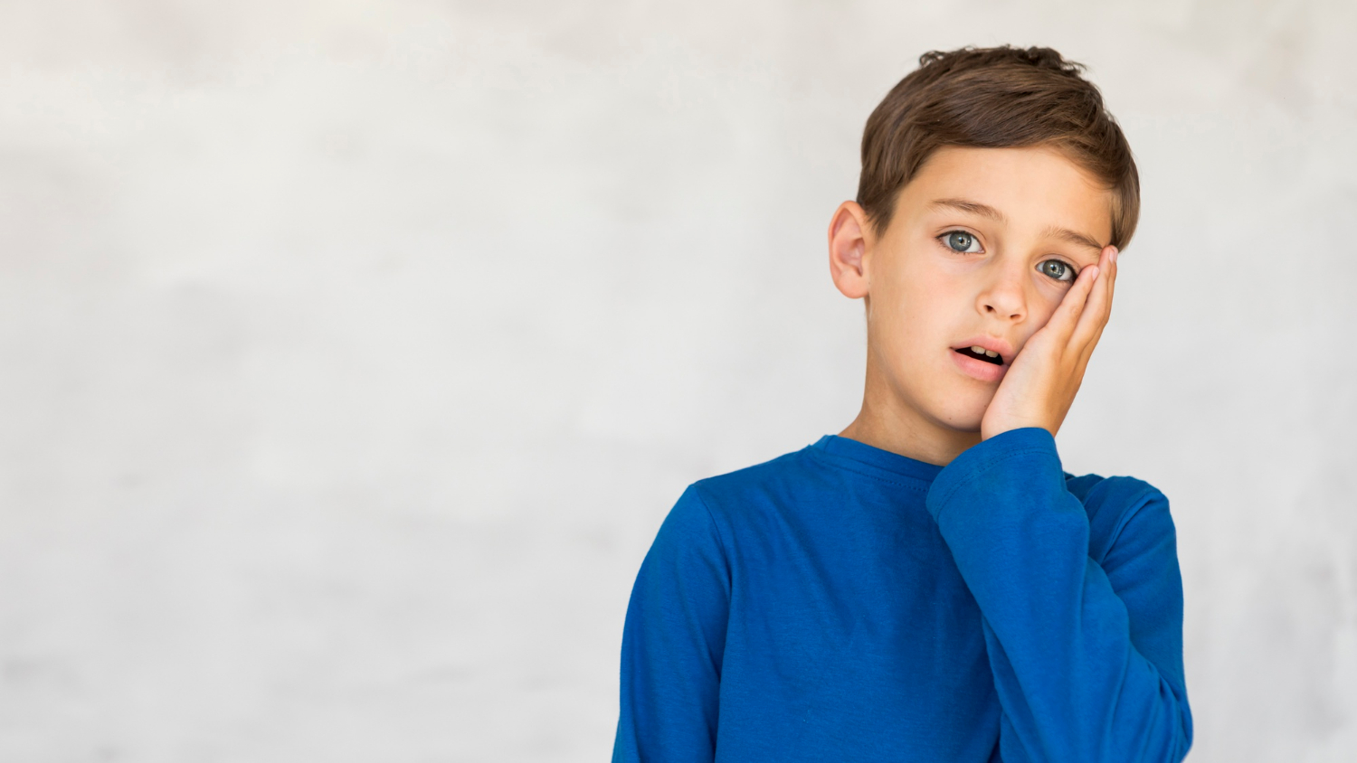 A stunned young boy | Source: Freepik