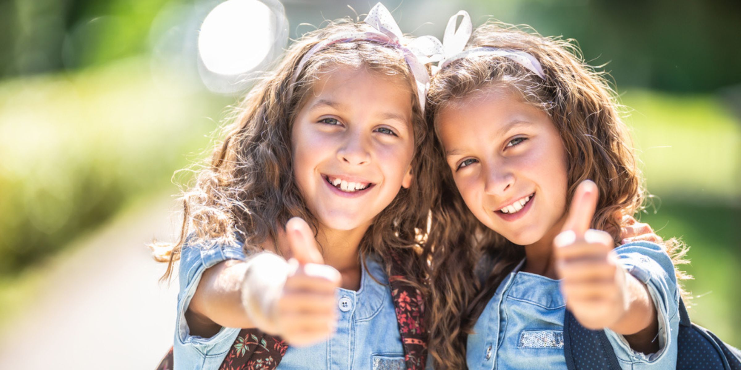 Smiling twin girls | Source: Shutterstock