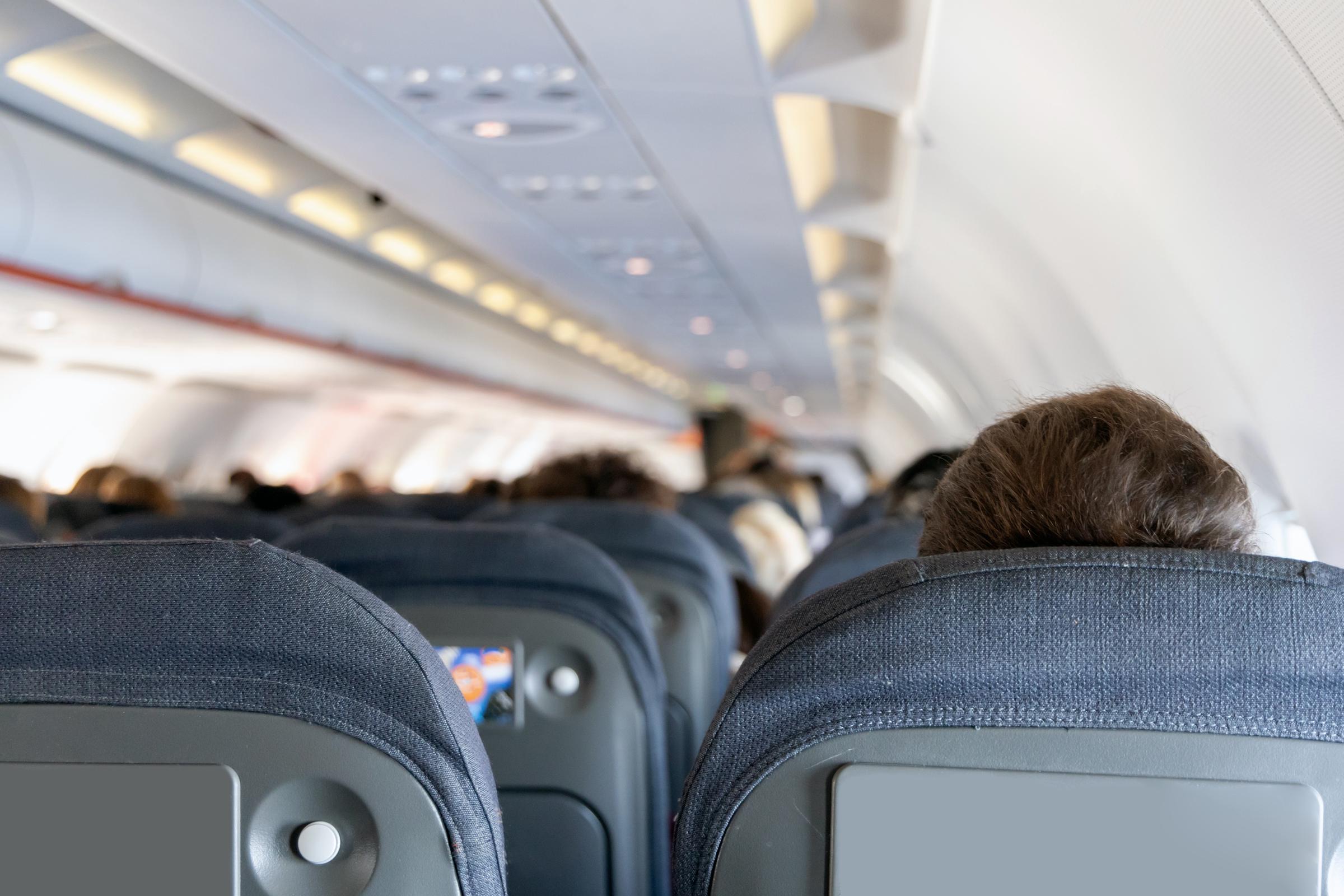 People in an airplane | Source: Shutterstock