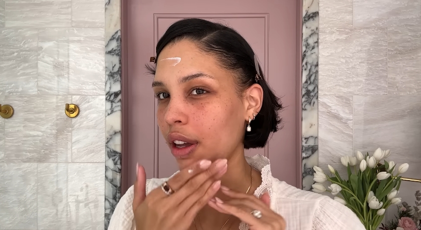 Nara Smith doing her skincare routine from a video dated December 12, 2024. | Source: YouTube/Vogue