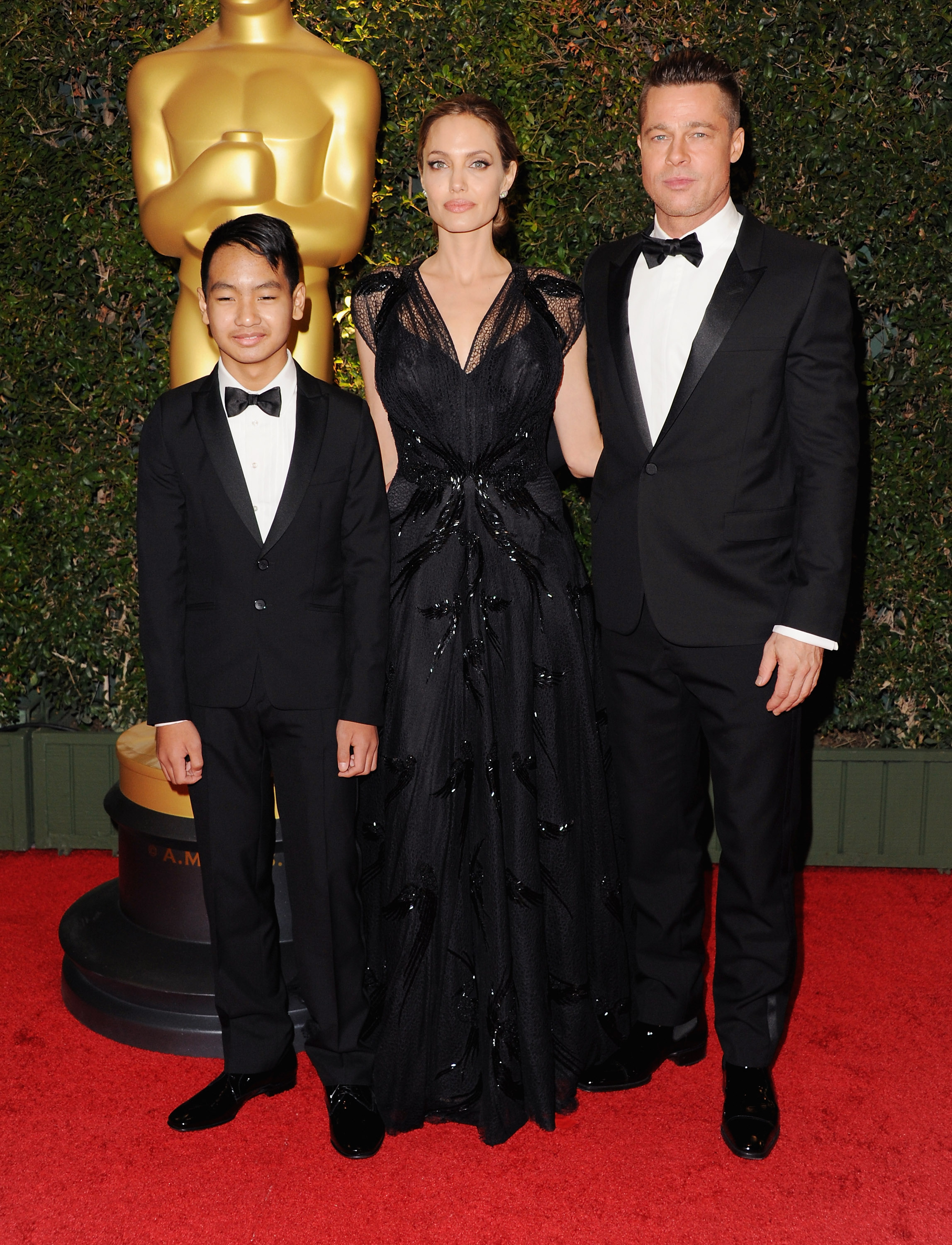 Actress Angelina Jolie, actor Brad Pitt and son Maddox Jolie-Pitt arrive at The Board Of Governors Of The Academy Of Motion Picture Arts And Sciences' Governor Awards at Dolby Theatre on November 16, 2013 in Hollywood, California. | Source: Getty Images