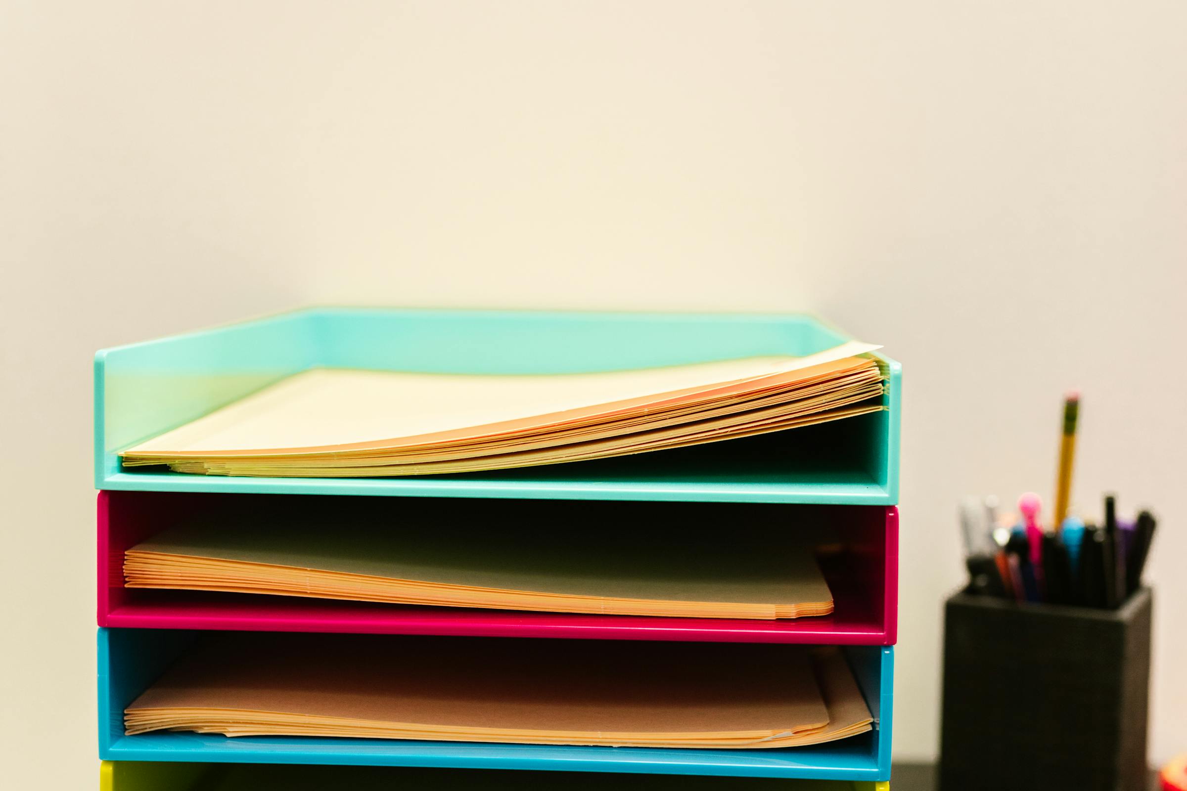 A set of folders arranged on a desk | Source: Pexels