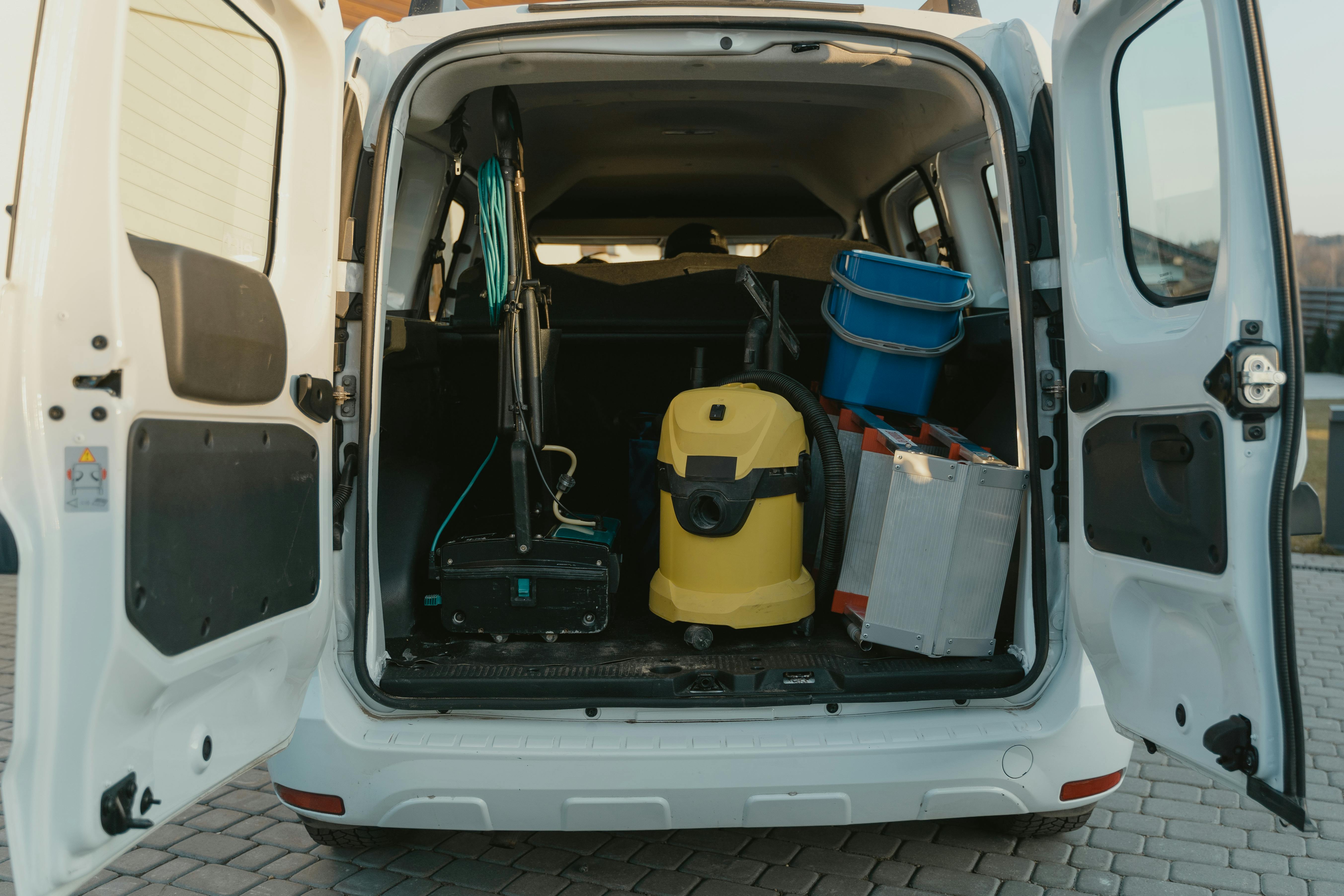 A white van with cleaning tools | Source: Pexels