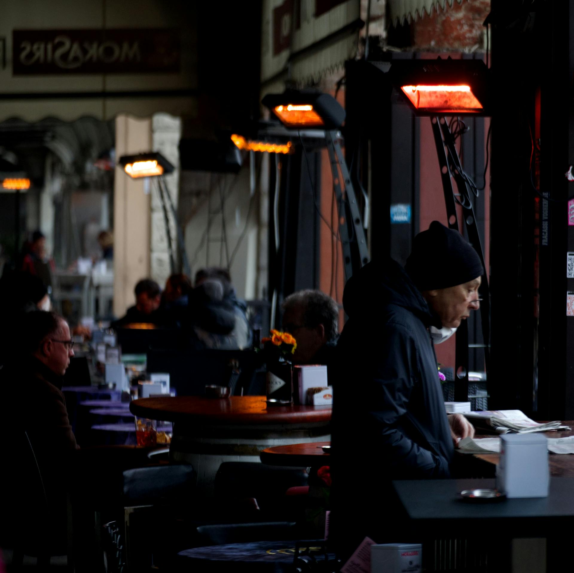 People in a coffee shop | Source: Midjourney