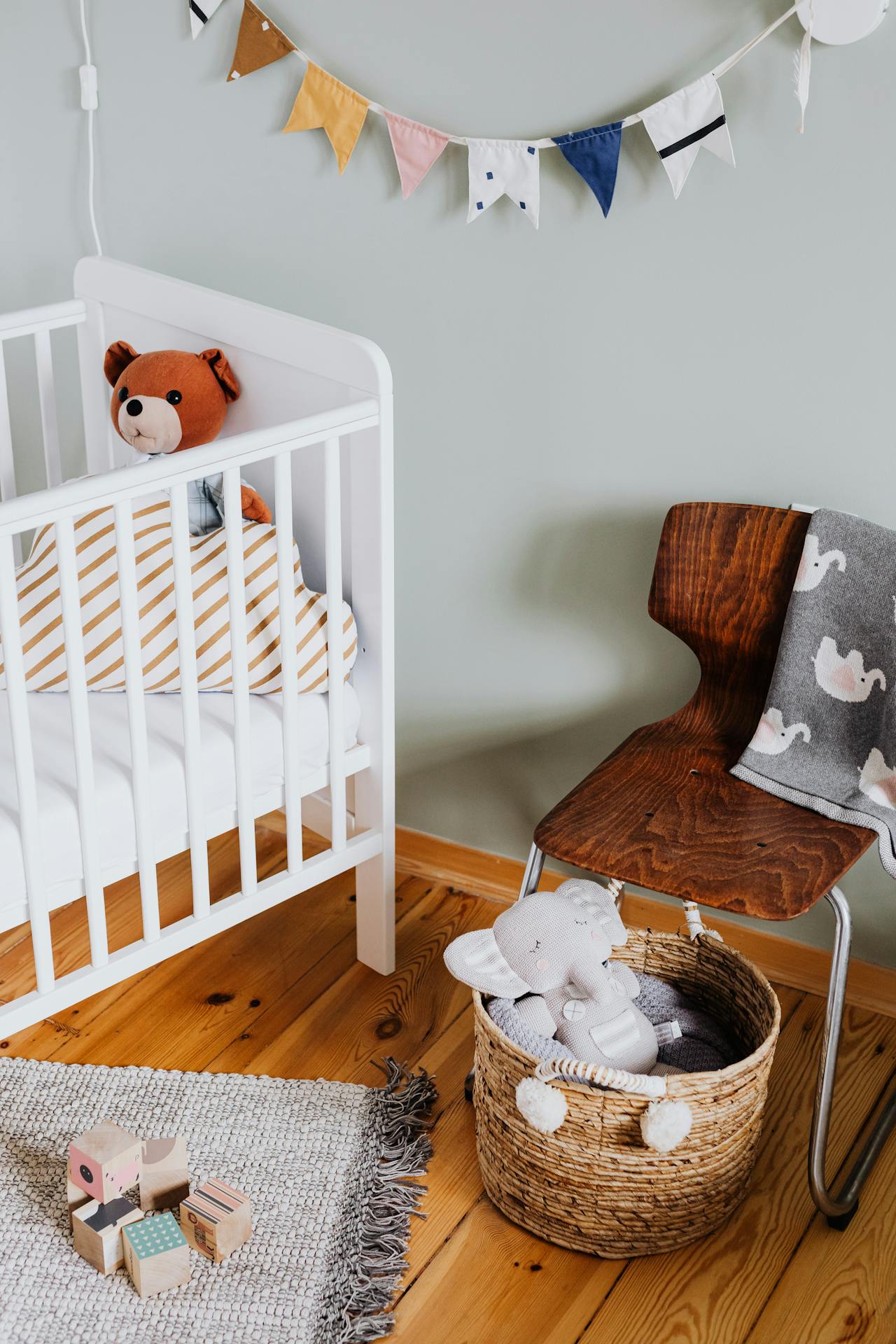 Crib and toys in a nursery | Source: Pexels