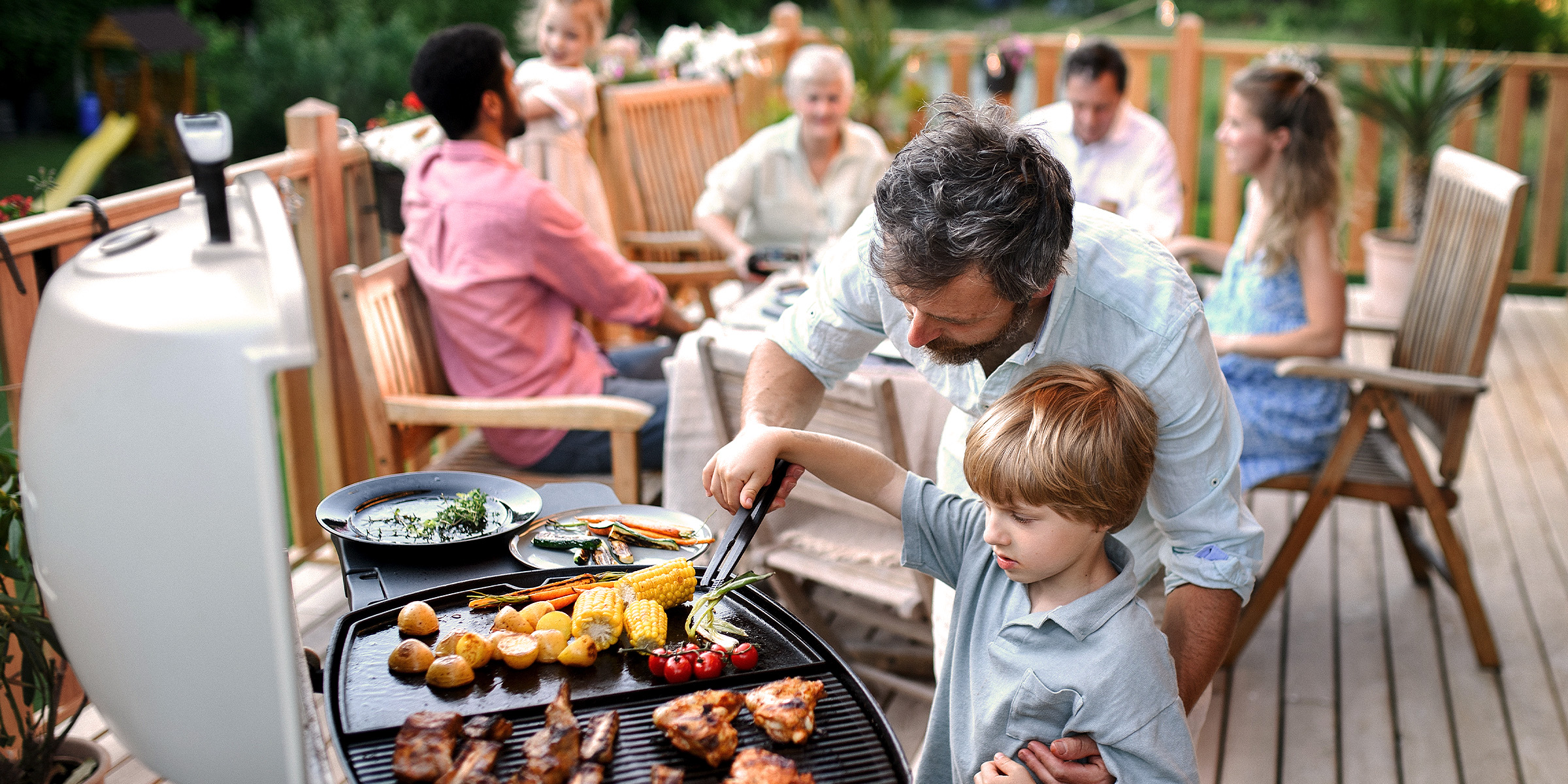 A family at a barbecue | Source: Shutterstock