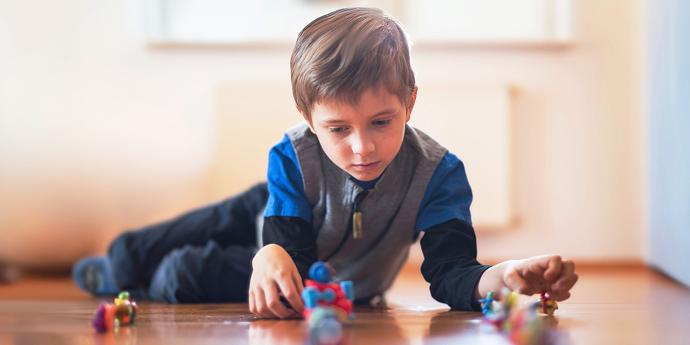 A boy playing with toys | Source: Shutterstock